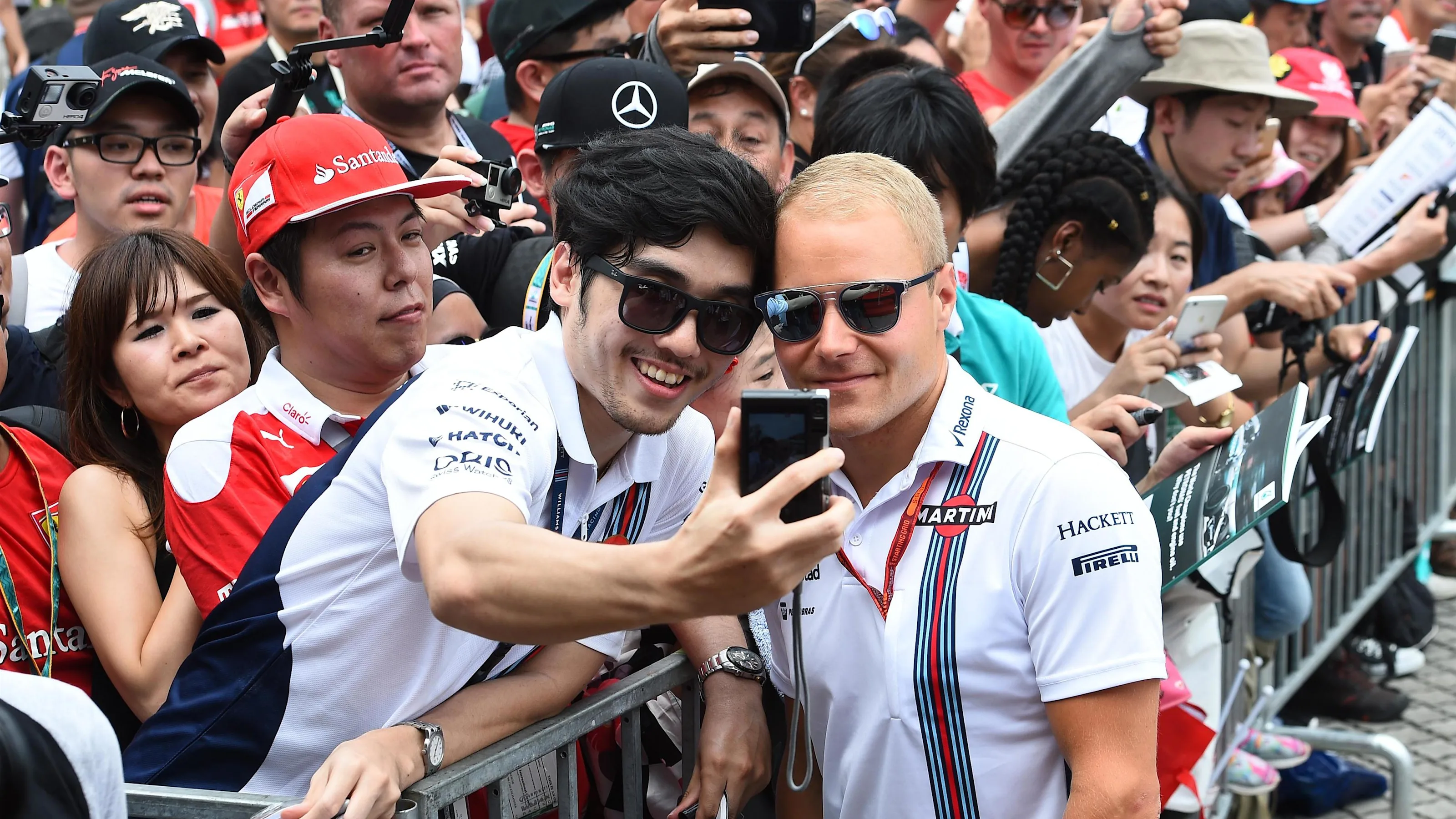 Valtteri Bottas (FIN) Williams poses for a fan selfie photograph at Formula One World Championship,