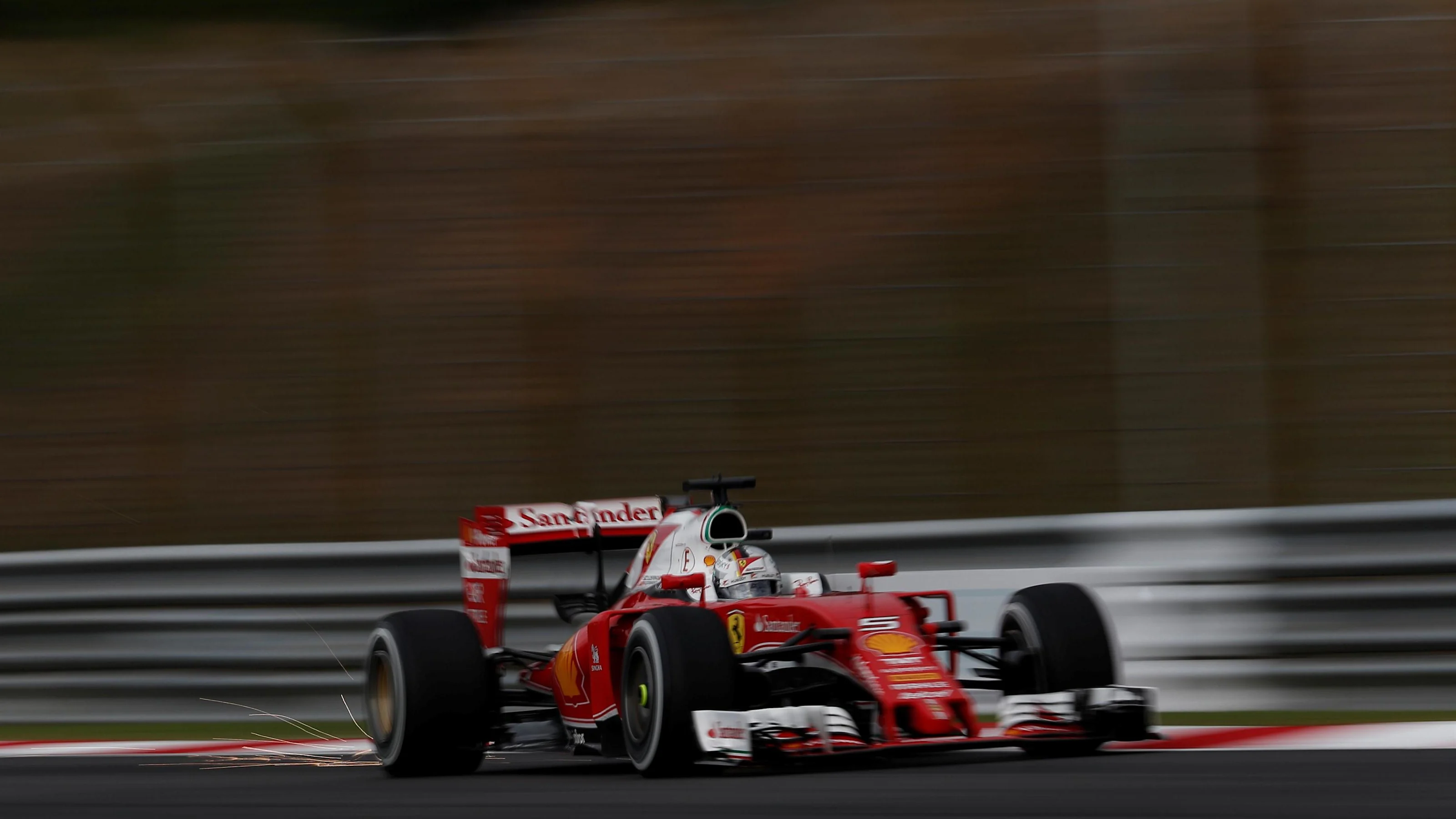 Sebastian Vettel (GER) Ferrari SF16-H sparks at Formula One World Championship, Rd16, Malaysian