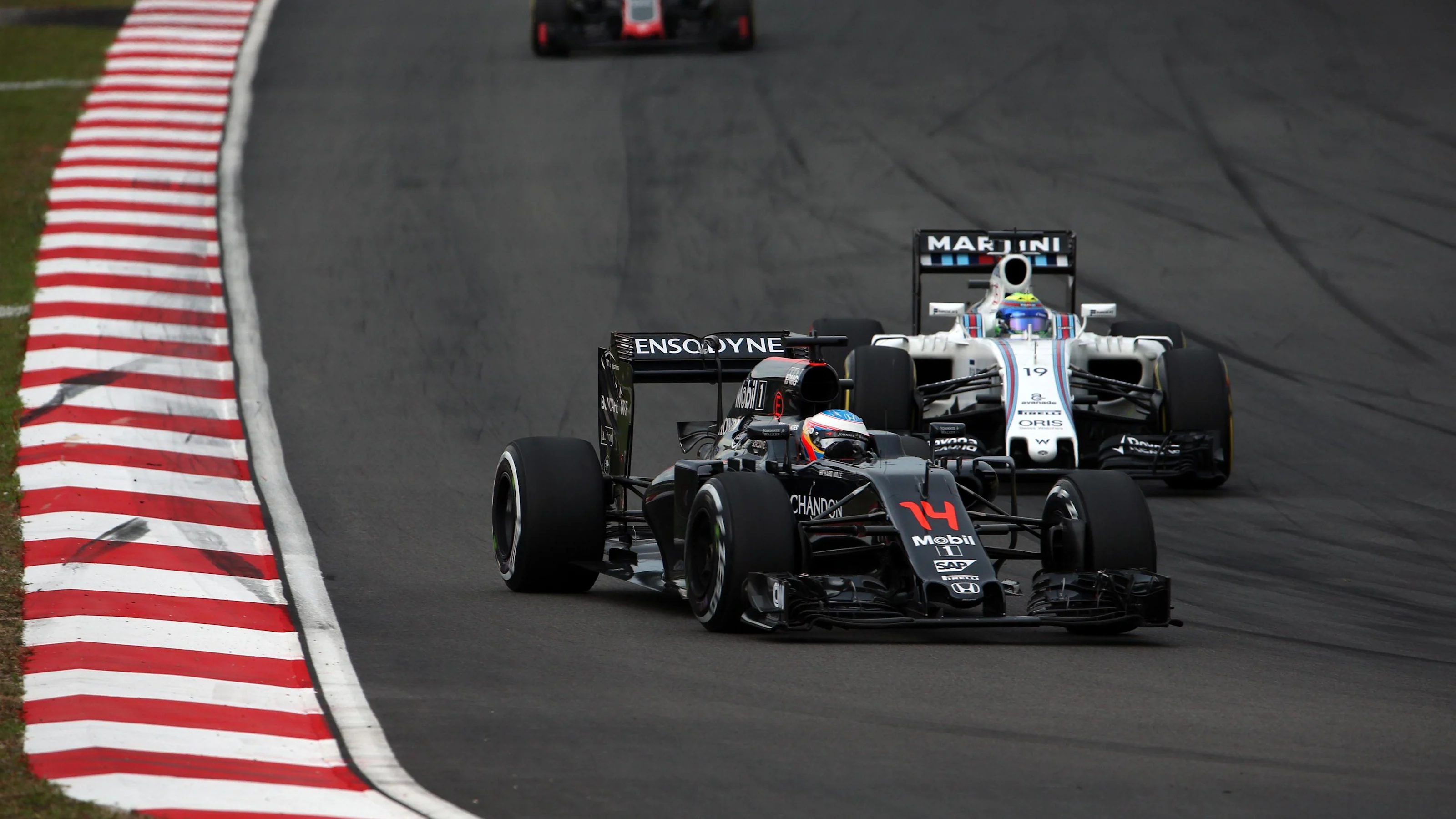 Fernando Alonso (ESP) McLaren MP4-31 and Felipe Massa (BRA) Williams FW38 at Formula One World