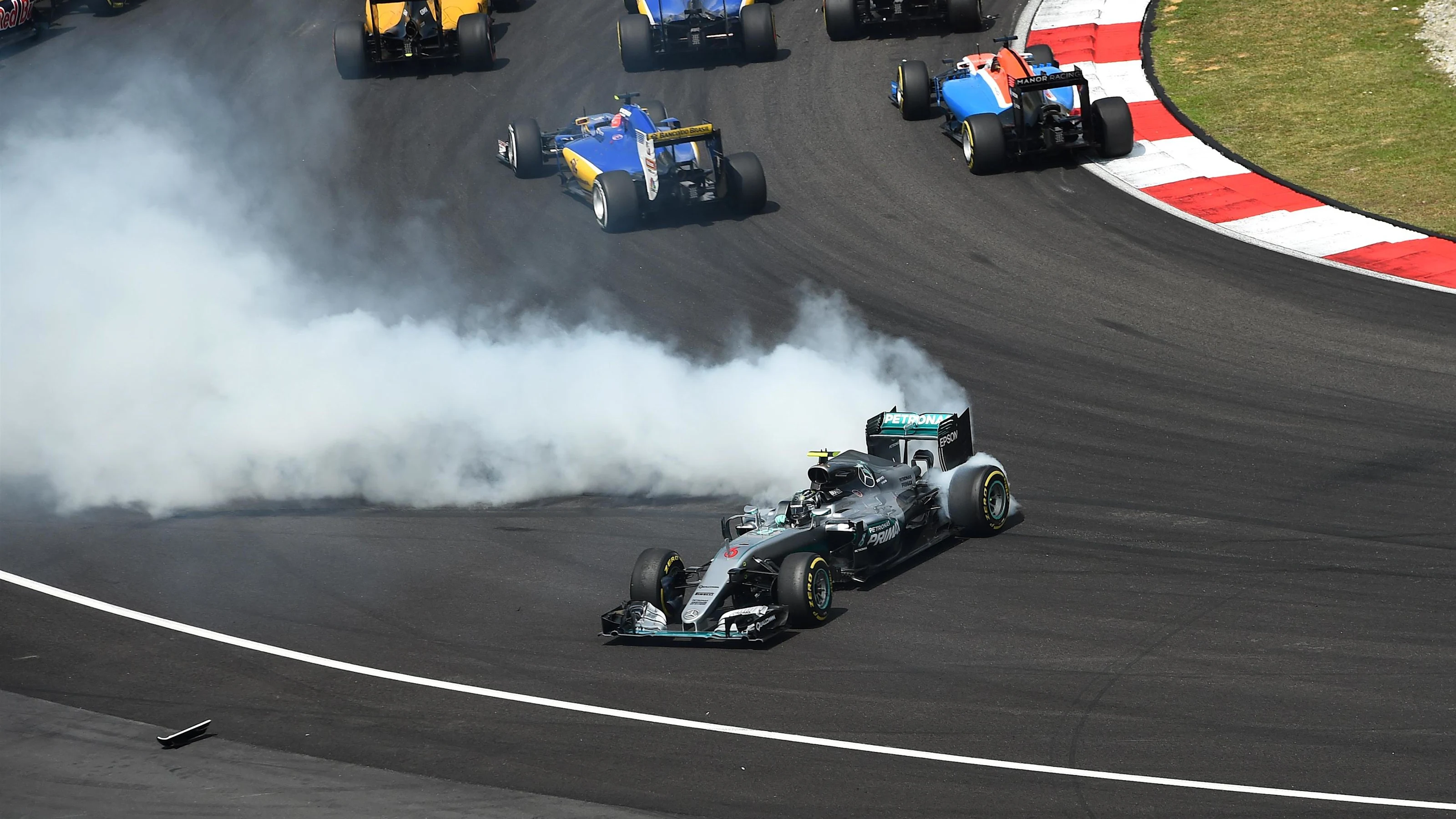 Nico Rosberg (GER) Mercedes-Benz F1 W07 Hybrid spins after contact at the start of the race at