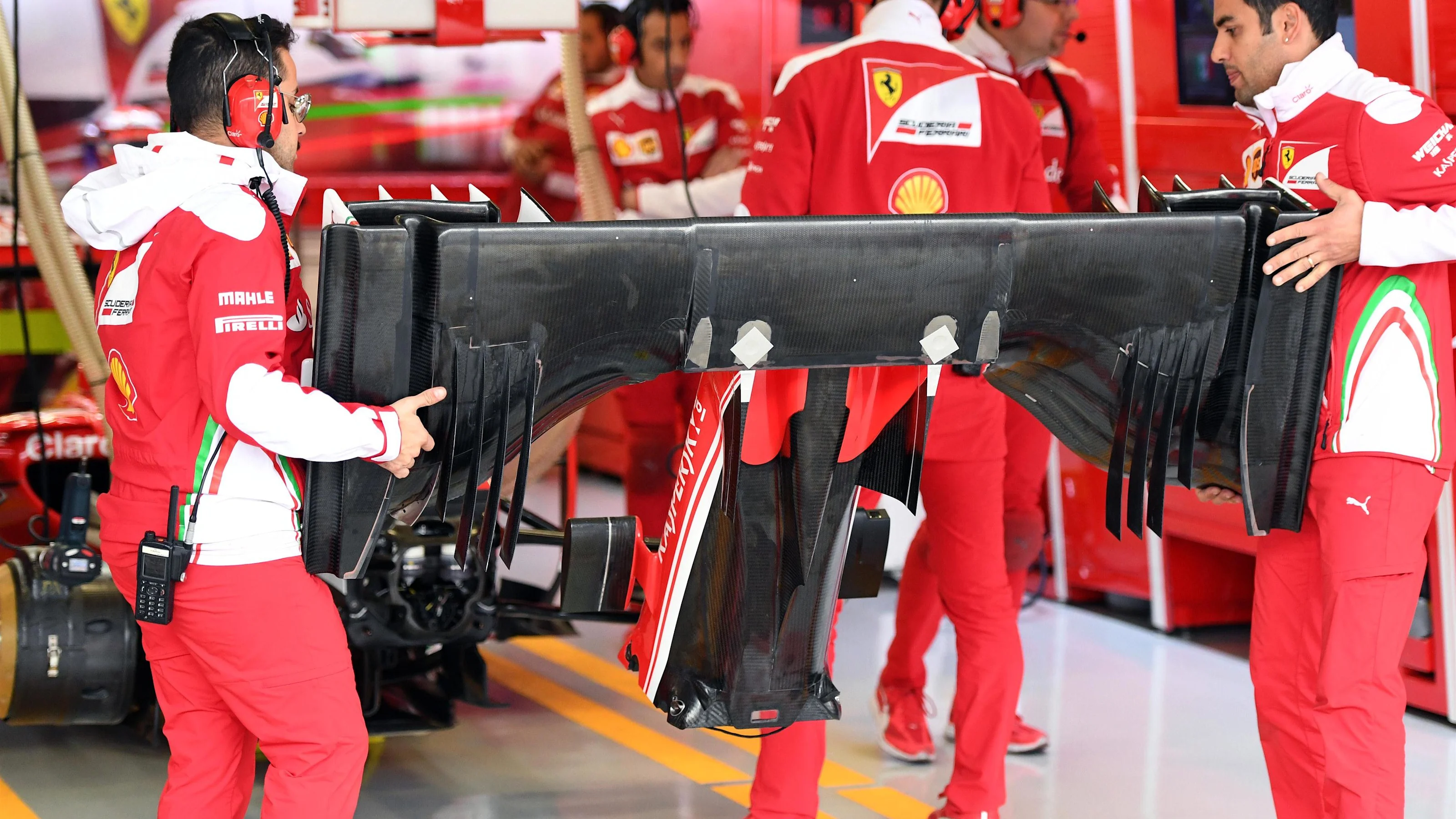 Ferrari mechanics with Ferrari SF16-H front wing at Formula One World Championship, Rd19, Mexican