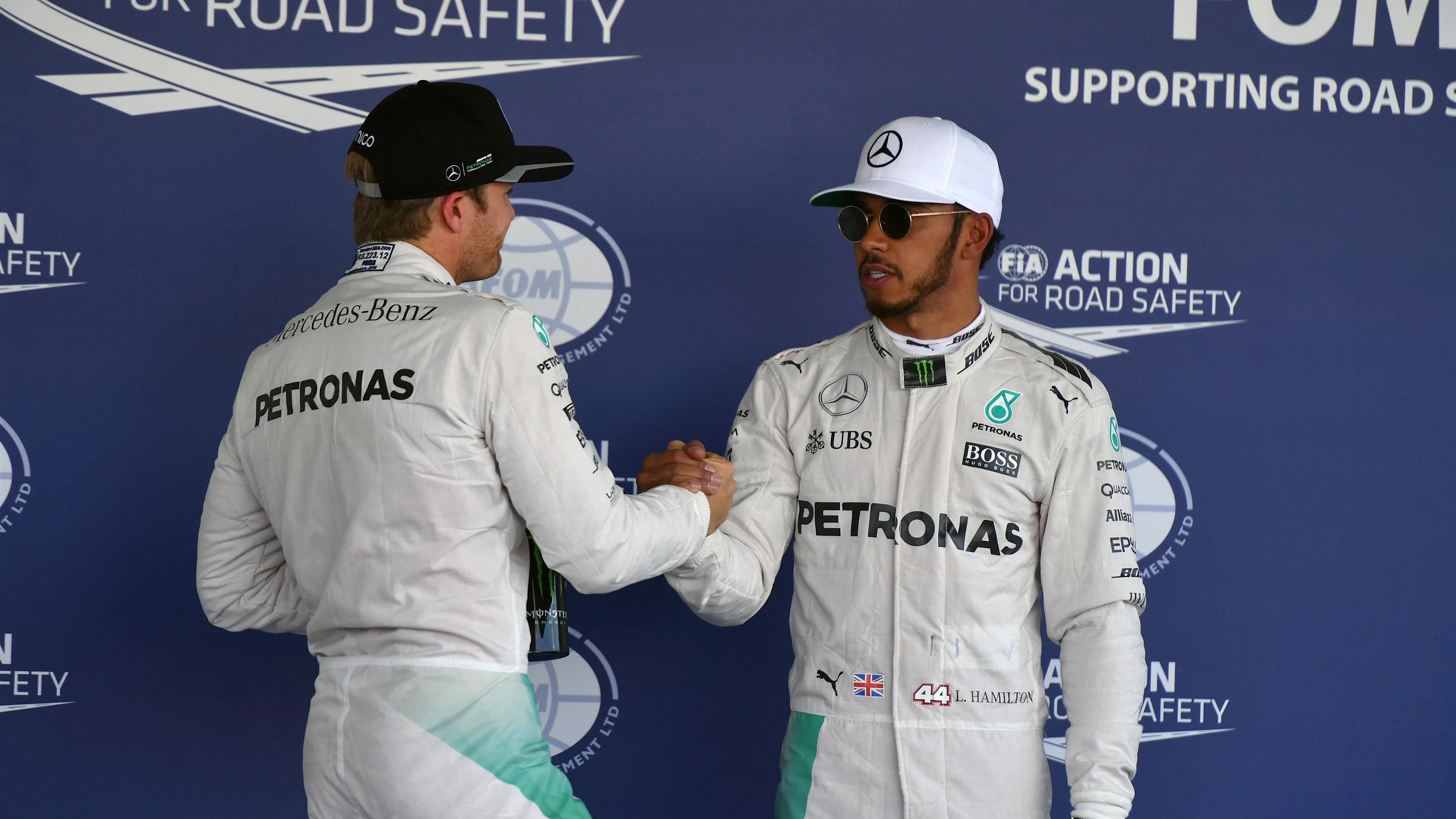 Pole sitter Lewis Hamilton (GBR) Mercedes AMG F1 celebrates with Nico Rosberg (GER) Mercedes AMG F1