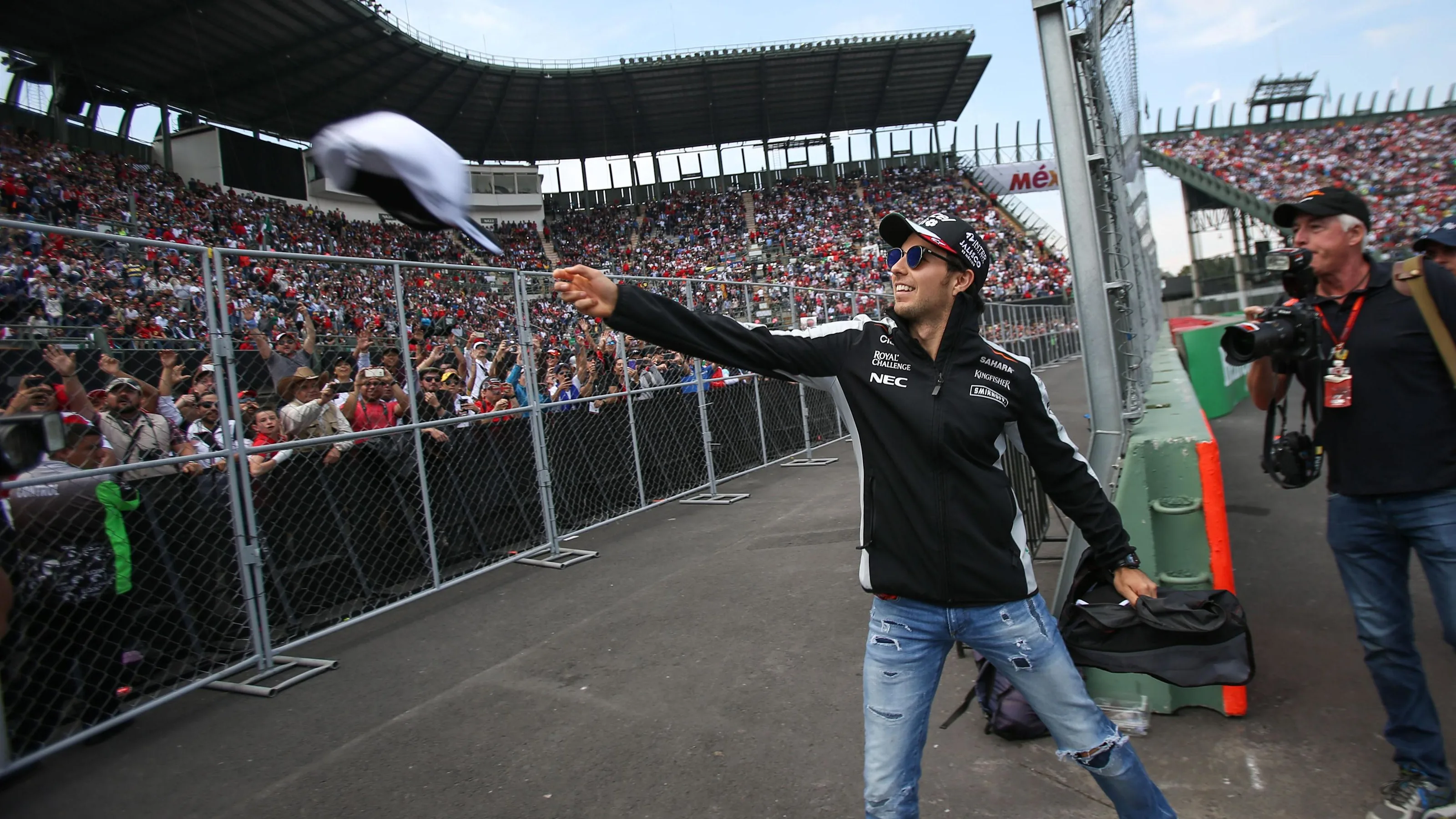 Sergio Perez (MEX) Force India throws hats into the crowd on the drivers parade at Formula One