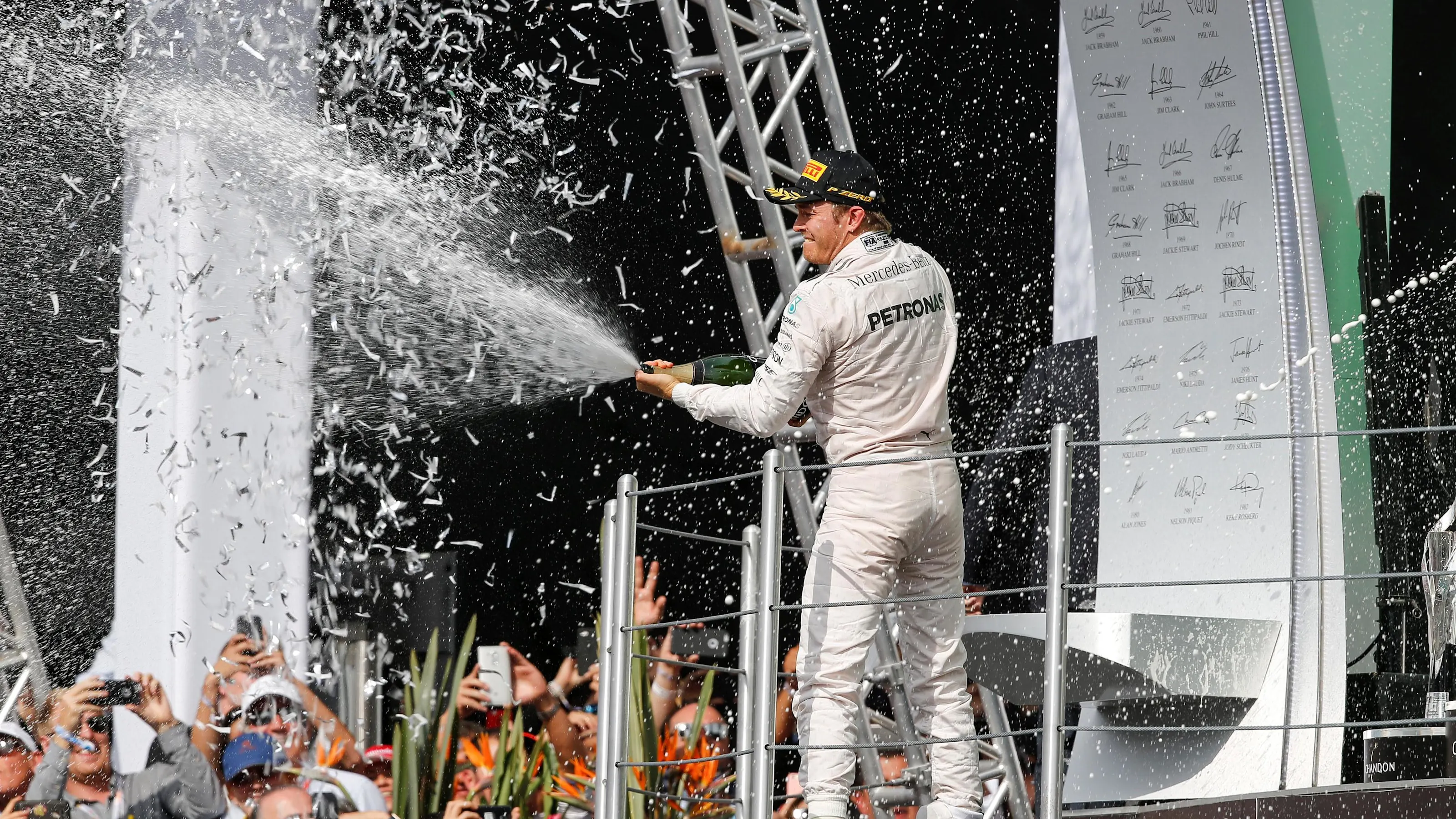 Nico Rosberg (GER) Mercedes AMG F1 celebrates on the podium with the champagne at Formula One World