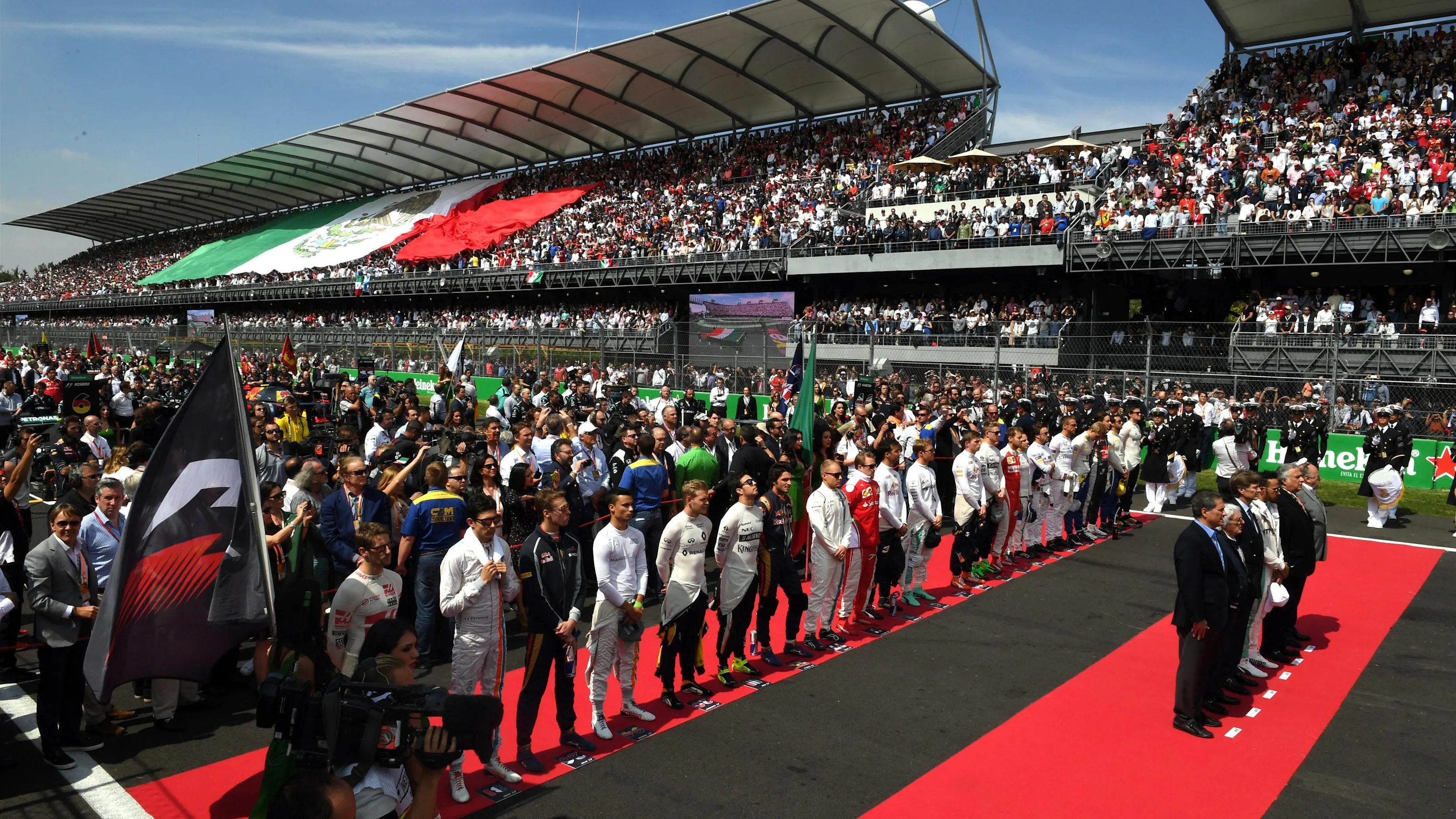 Drivers observe the Mexican National Anthem on the grid at Formula One World Championship, Rd19,