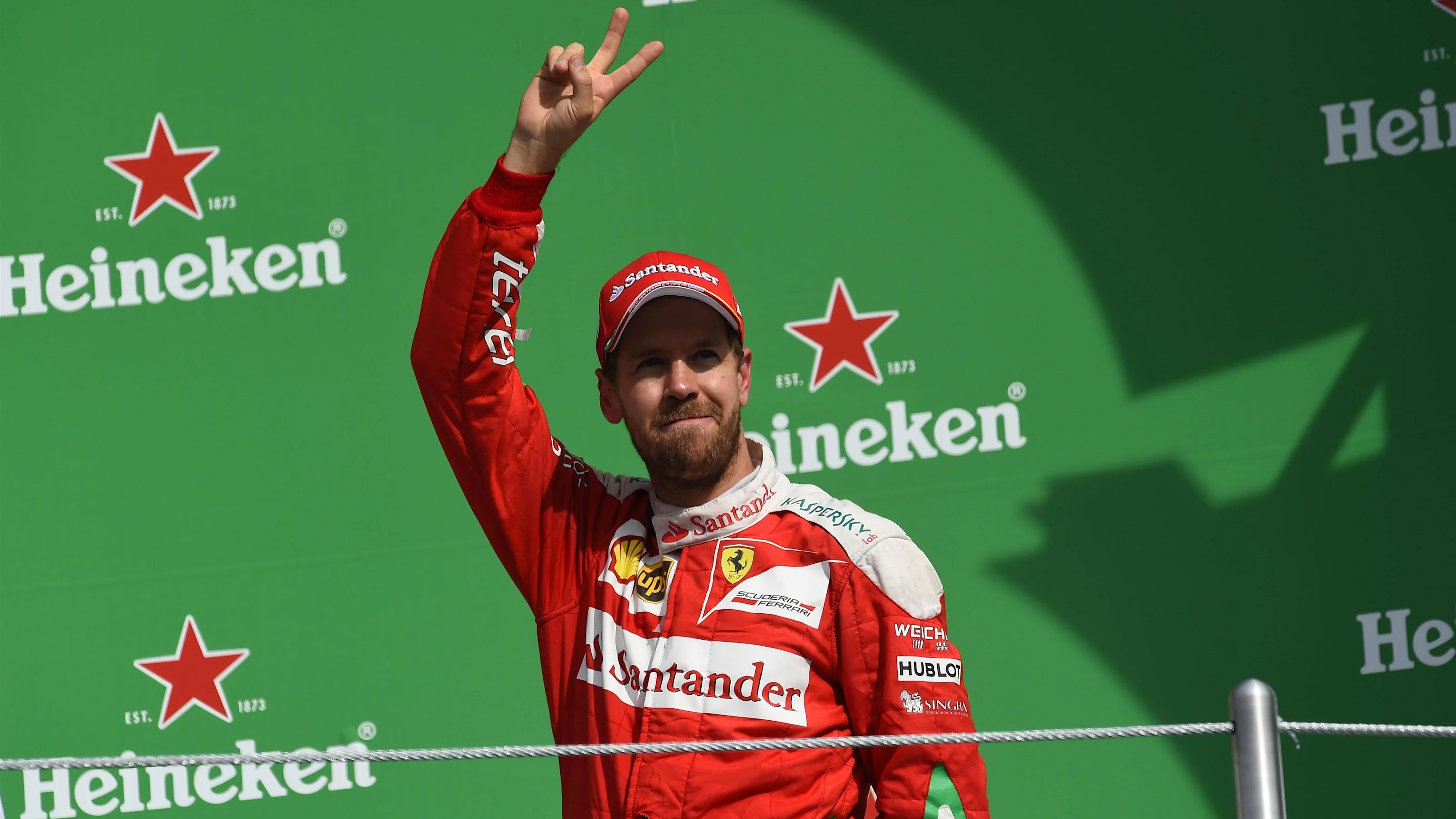 Sebastian Vettel (GER) Ferrari celebrates on the podium at Formula One World Championship, Rd19,