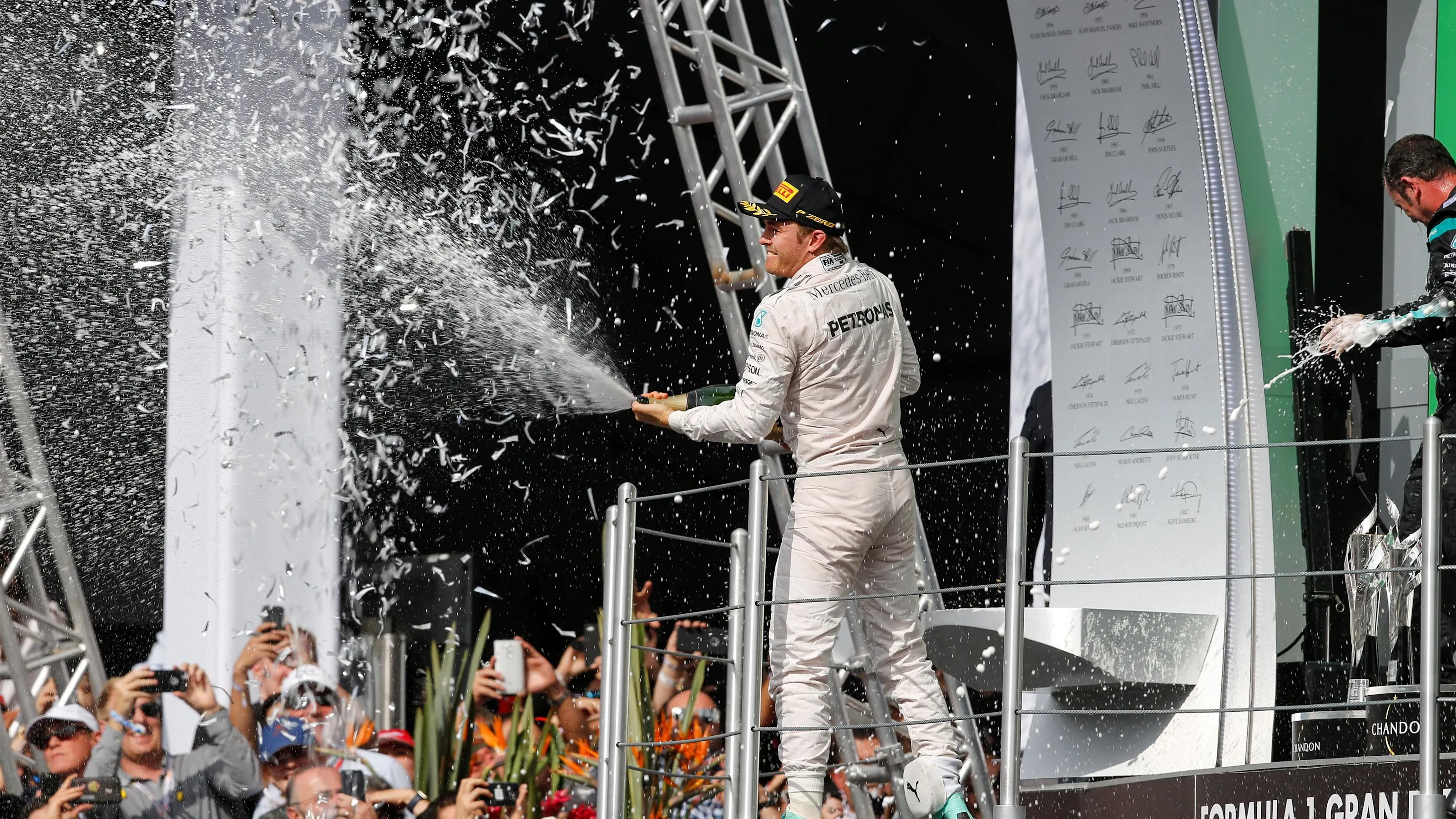 Nico Rosberg (GER) Mercedes AMG F1 celebrates on the podium with the champagne at Formula One World