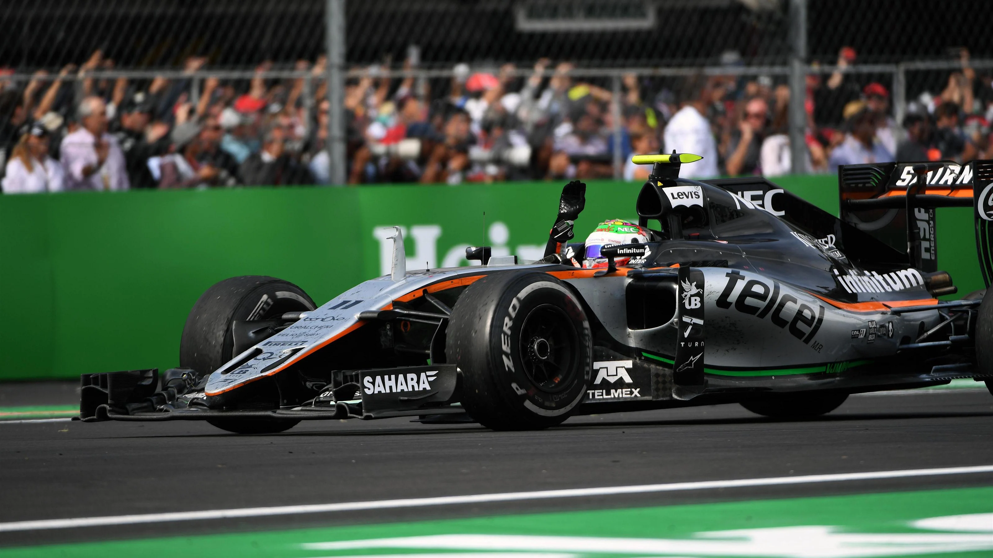 Sergio Perez (MEX) Force India VJM09 waves to the crowd at Formula One World Championship, Rd19,
