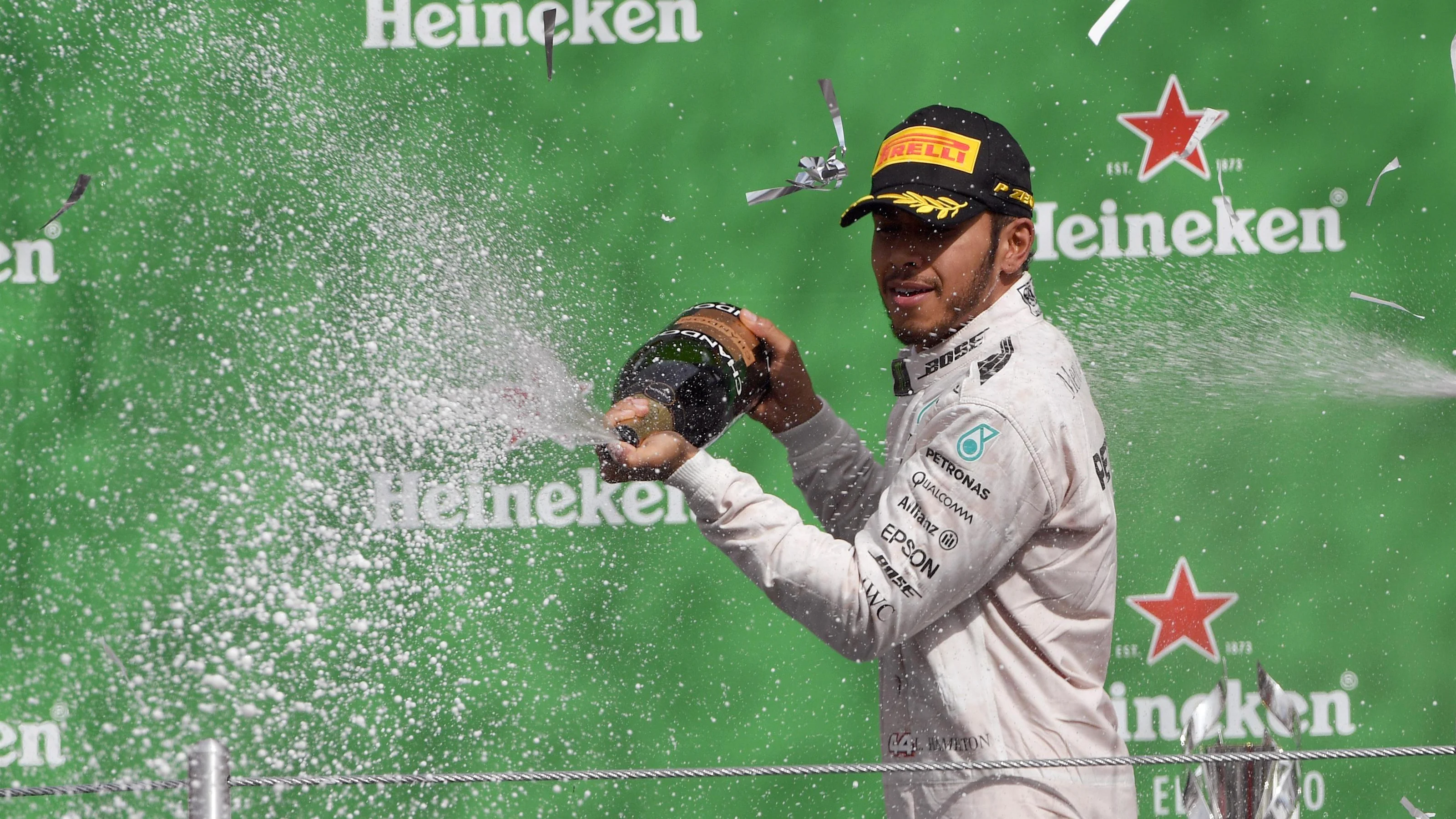 Race winner Lewis Hamilton (GBR) Mercedes AMG F1 celebrates on the podium with the champagne at
