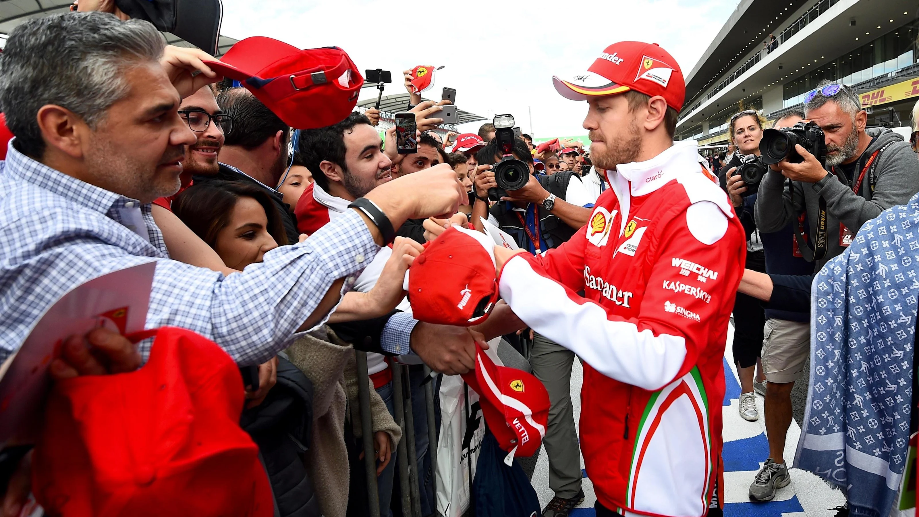 Sebastian Vettel (GER) Ferrari signs autographs for the fans at Formula One World Championship,