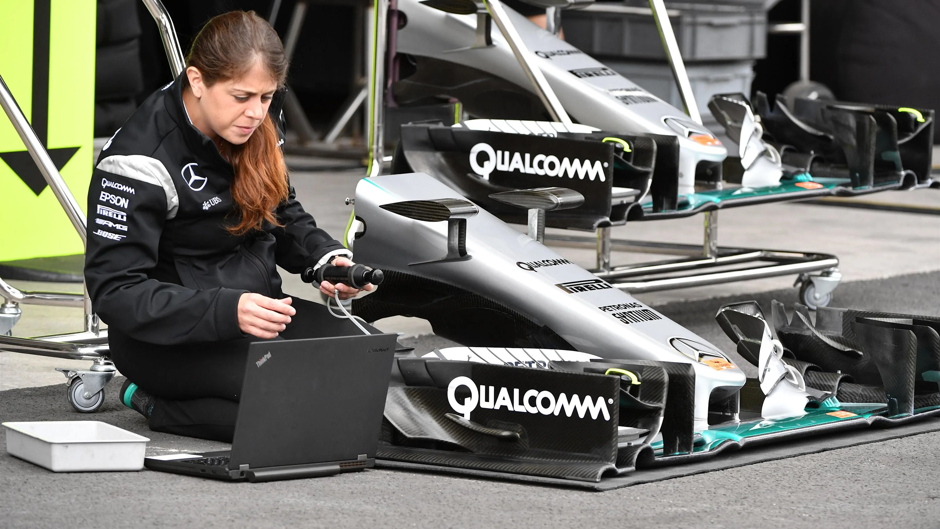 Mercedes AMG F1 mechanic works on Mercedes-Benz F1 W07 Hybrid nose and front wing at Formula One