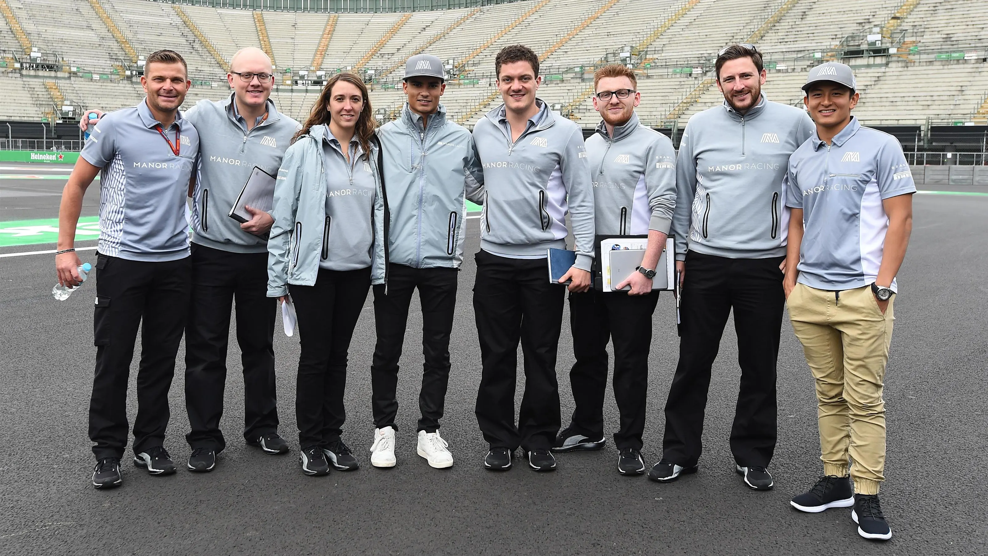 Pascal Wehrlein (GER) Manor Racing and Rio Haryanto (IDN) Manor Racing with team personel at