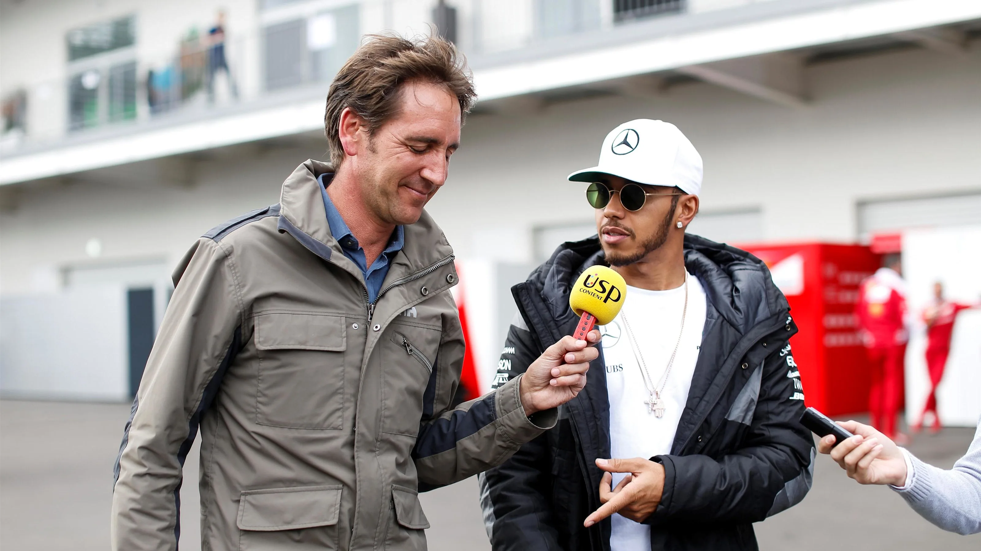 Lewis Hamilton (GBR) Mercedes AMG F1 talks with Tom Clarkson (GBR) BBC Television at Formula One