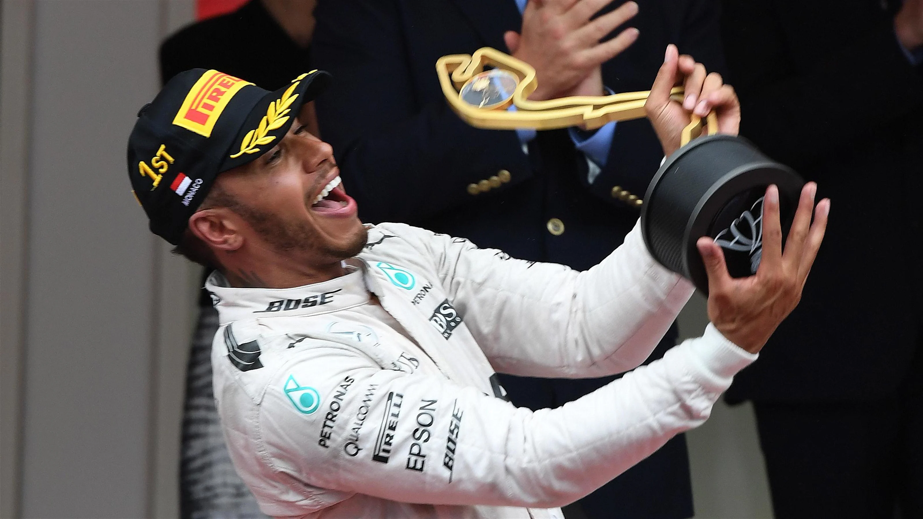 Lewis Hamilton (GBR) Mercedes AMG F1 celebrates with the trophy on the podium at Formula One World