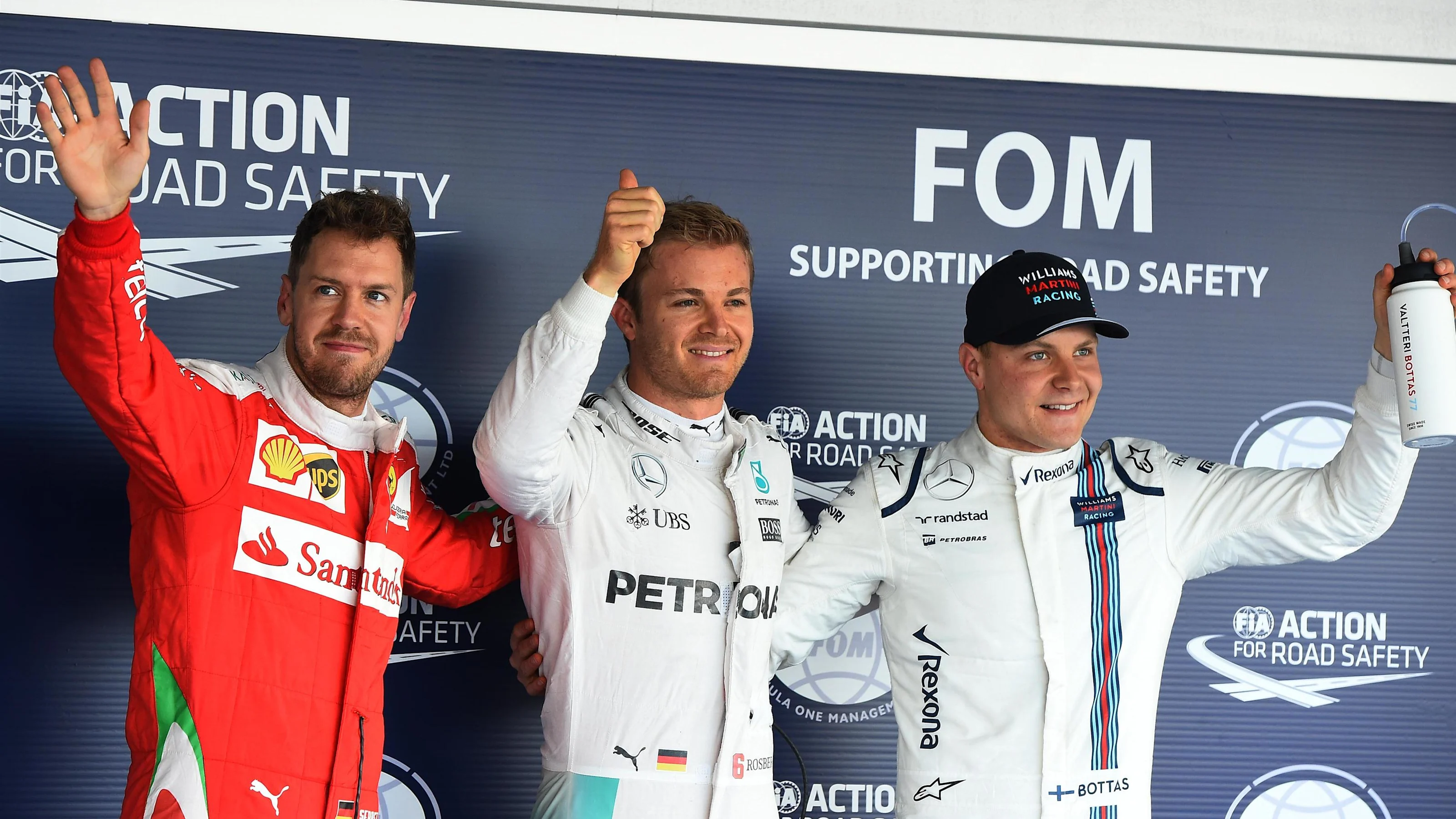 (L to R): Sebastian Vettel (GER) Ferrari, pole sitter Nico Rosberg (GER) Mercedes AMG F1 and