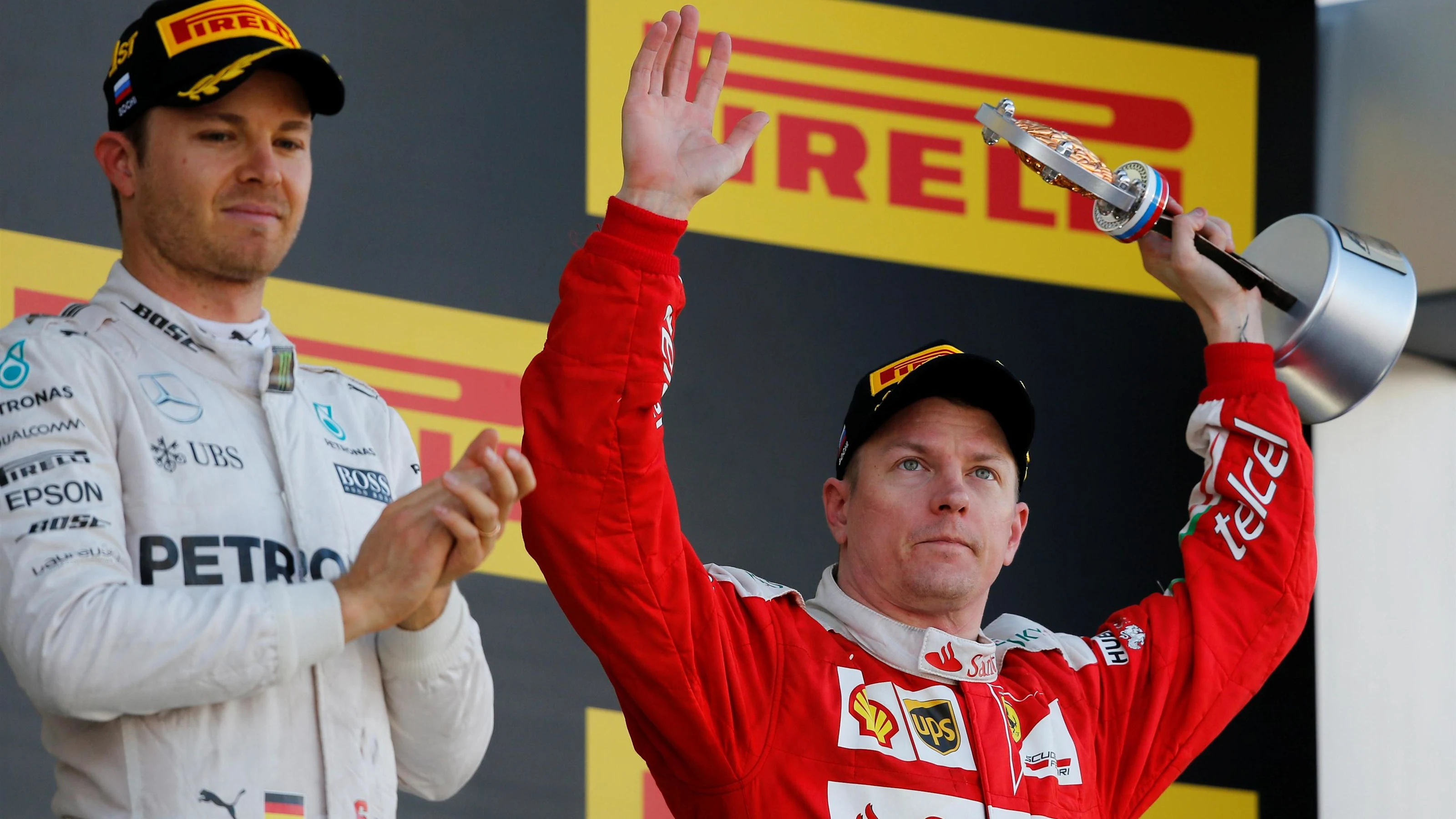 Nico Rosberg (GER) Mercedes AMG F1 and Kimi Raikkonen (FIN) Ferrari celebrate with thr trophy at