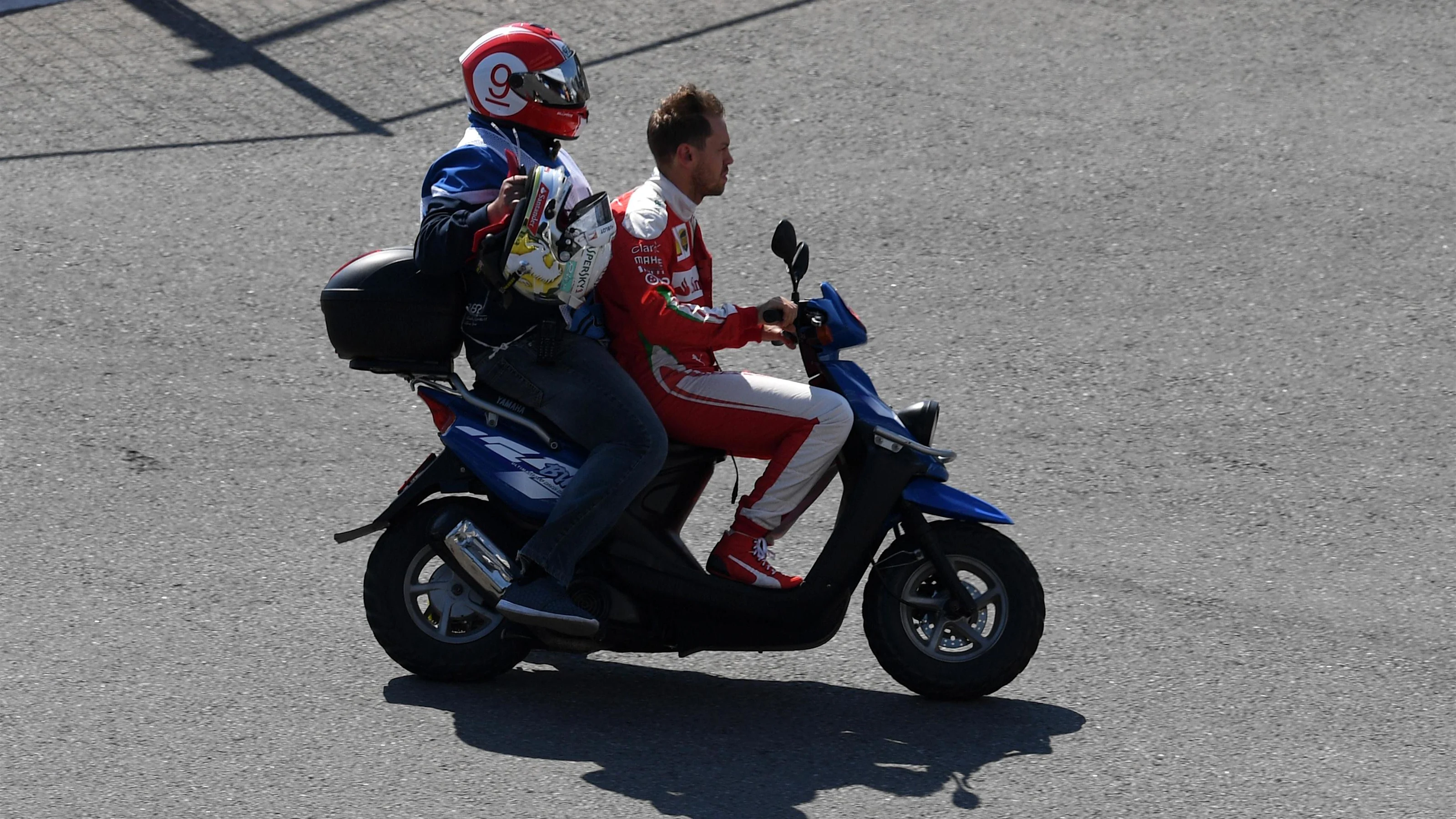 Lap one race retiree Sebastian Vettel (GER) Ferrari on a moped at  Formula One World Championship,