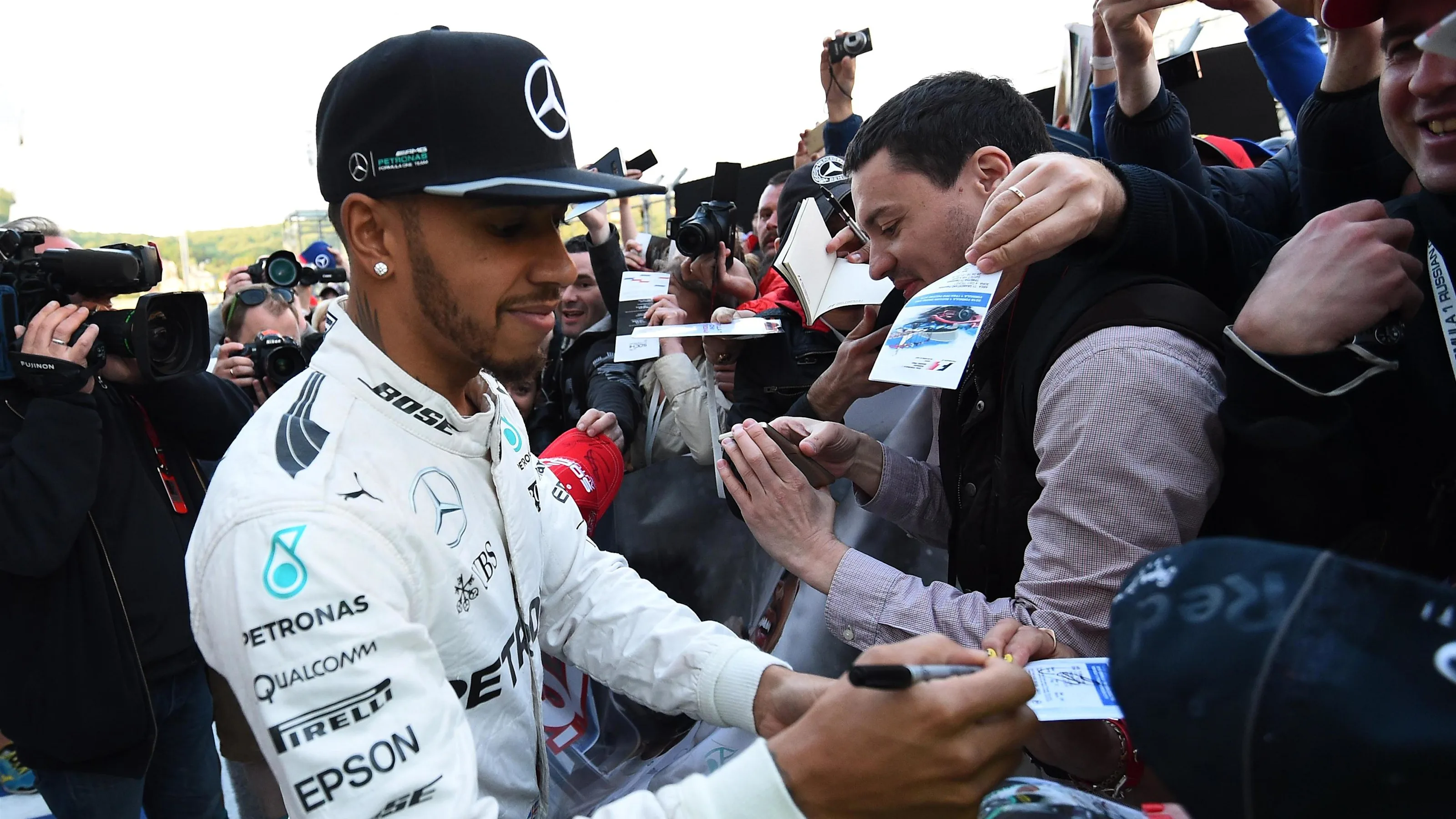 Lewis Hamilton (GBR) Mercedes AMG F1 signs autographs for the fans at Formula One World