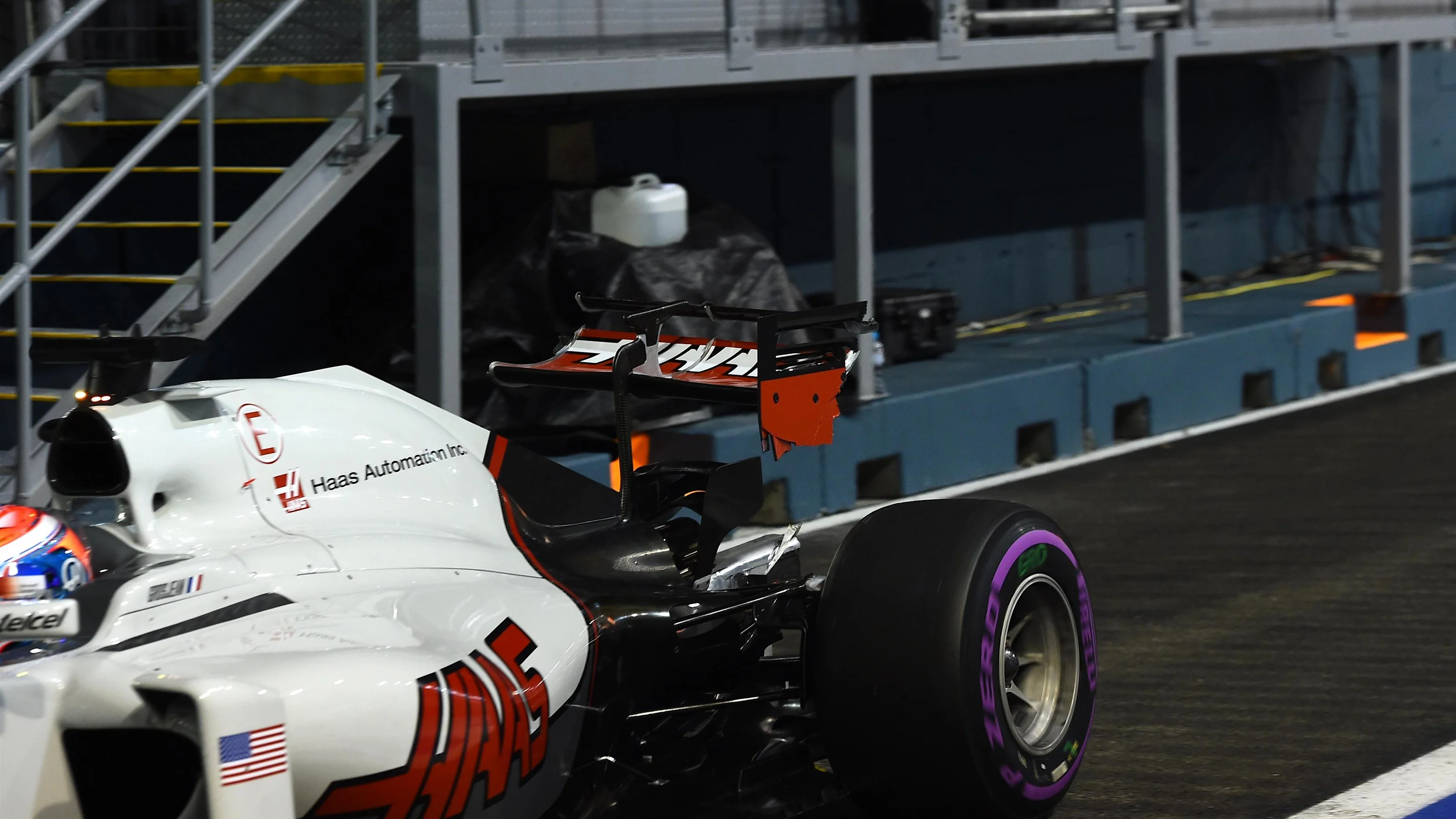 Romain Grosjean (FRA) Haas VF-16 with broken rear wing after hitting the wall in FP2 at Formula One