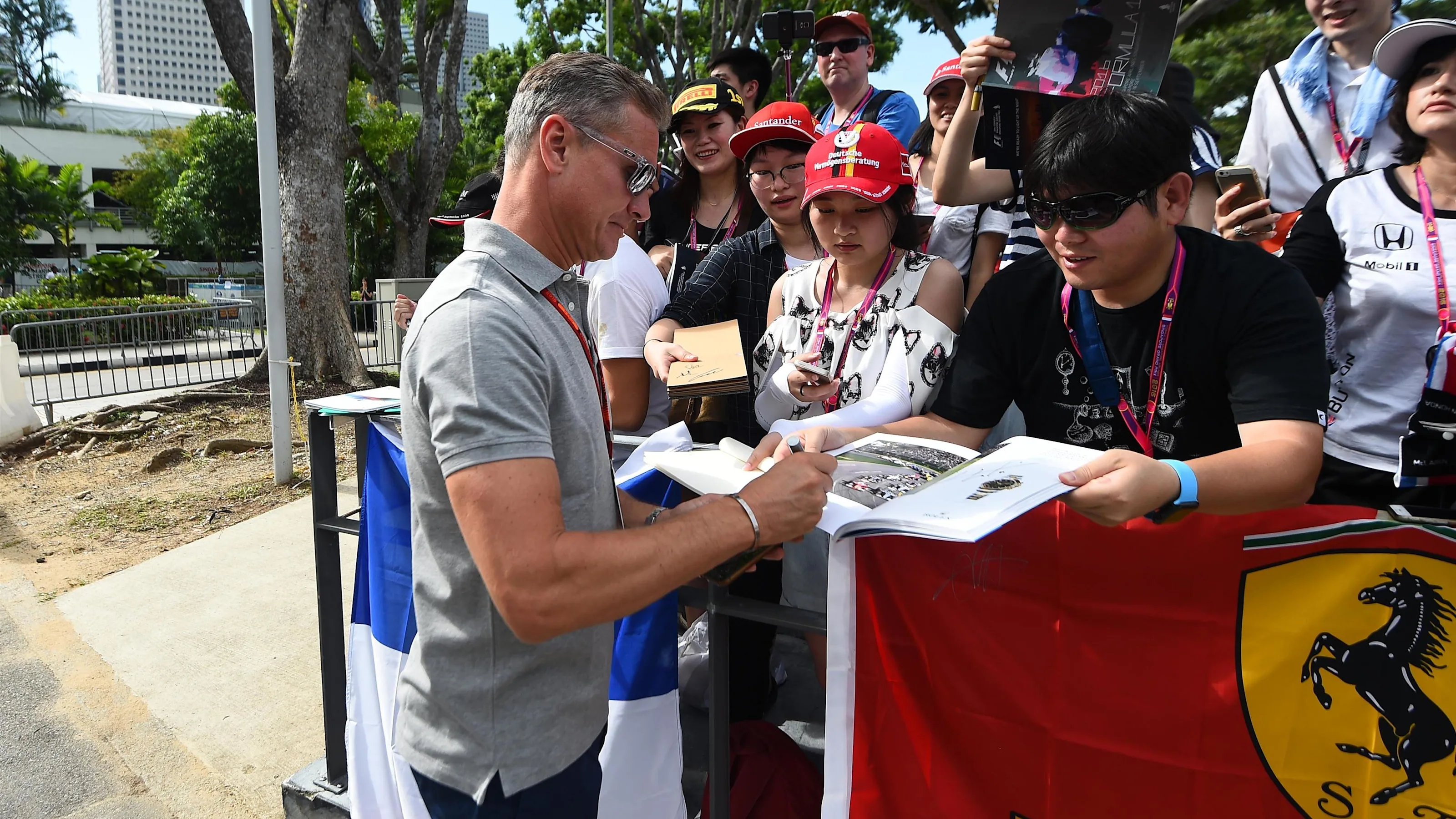 David Coulthard (GBR) Channel Four TV Commentator signs autographs for the fans at Formula One