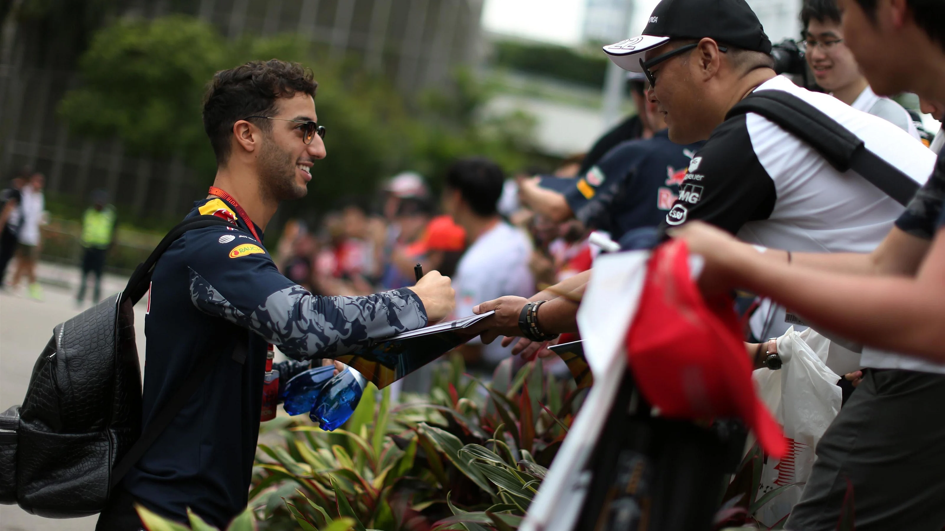 Daniel Ricciardo (AUS) Red Bull Racing signs autographs for the fans at Formula One World