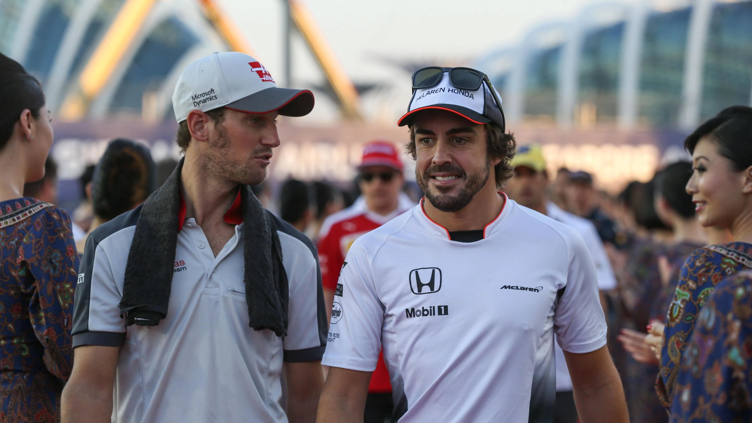 Romain Grosjean (FRA) Haas F1 and Fernando Alonso (ESP) McLaren on the drivers parade at Formula