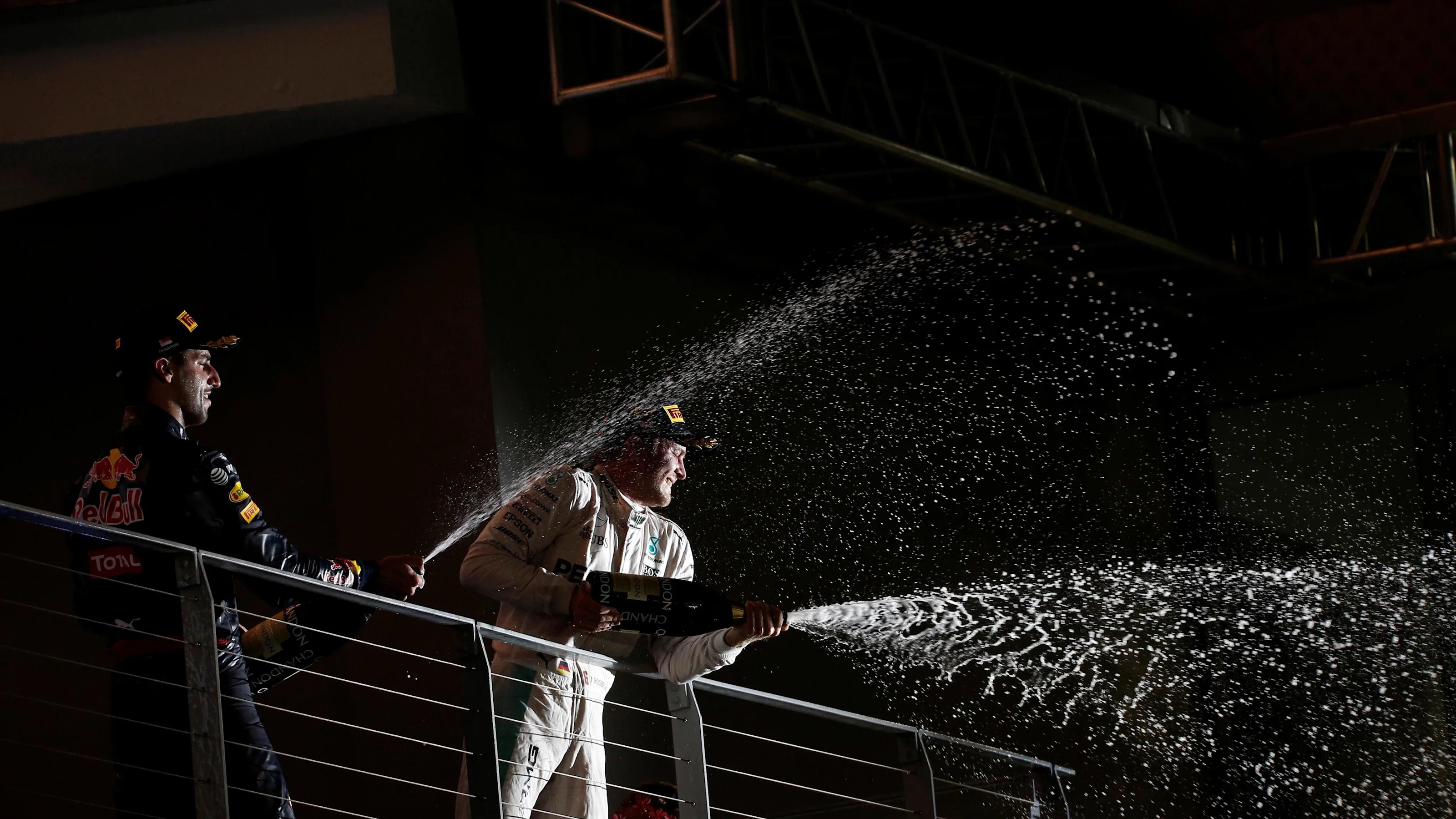 Daniel Ricciardo (AUS) Red Bull Racing and Race winner Nico Rosberg (GER) Mercedes AMG F1 celebrate