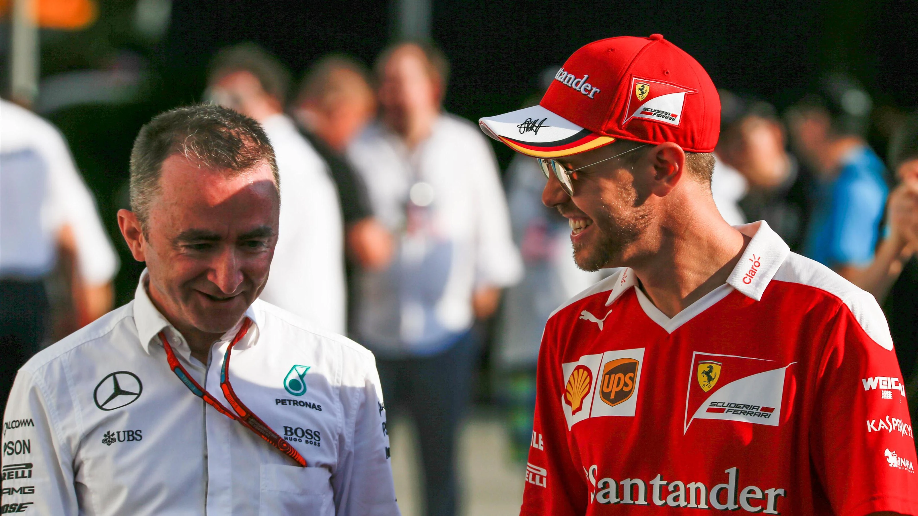 Paddy Lowe (GBR) Mercedes AMG F1 Executive Director (Technical) and Sebastian Vettel (GER) Ferrari
