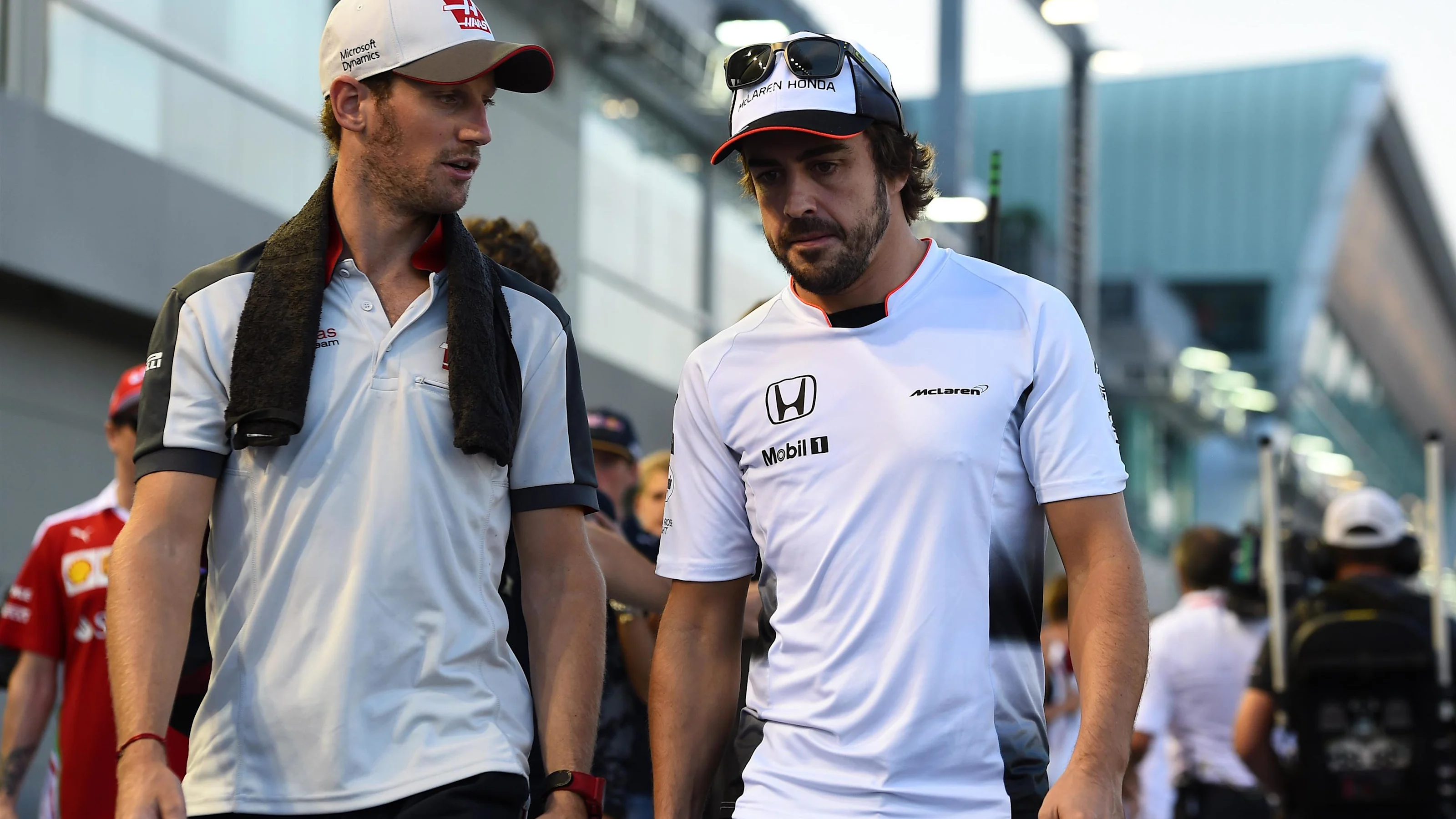 Romain Grosjean (FRA) Haas F1 AND Fernando Alonso (ESP) McLaren on the drivers parade at Formula