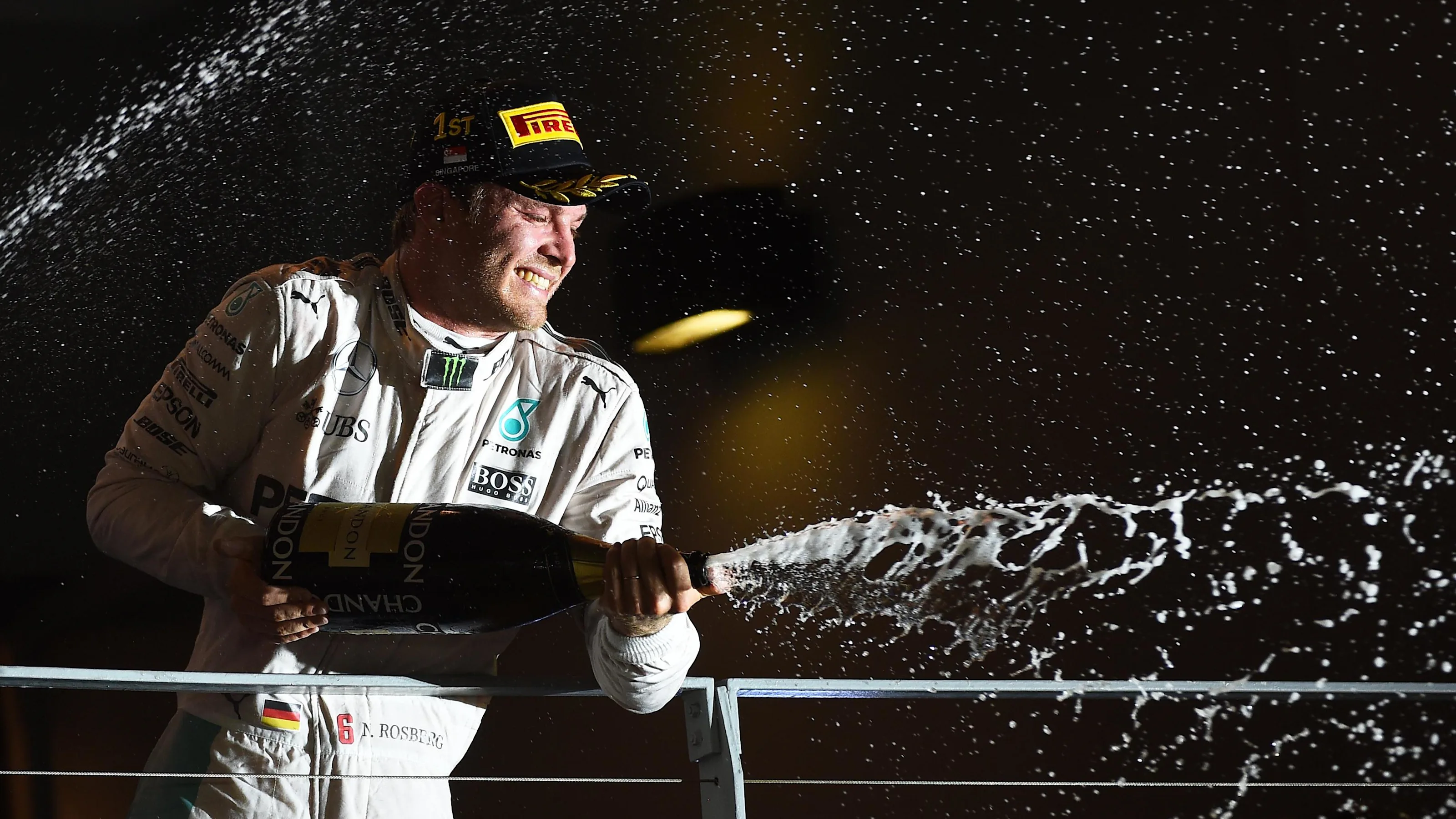 Race winner Nico Rosberg (GER) Mercedes AMG F1 celebrates on the podium with the champagne at