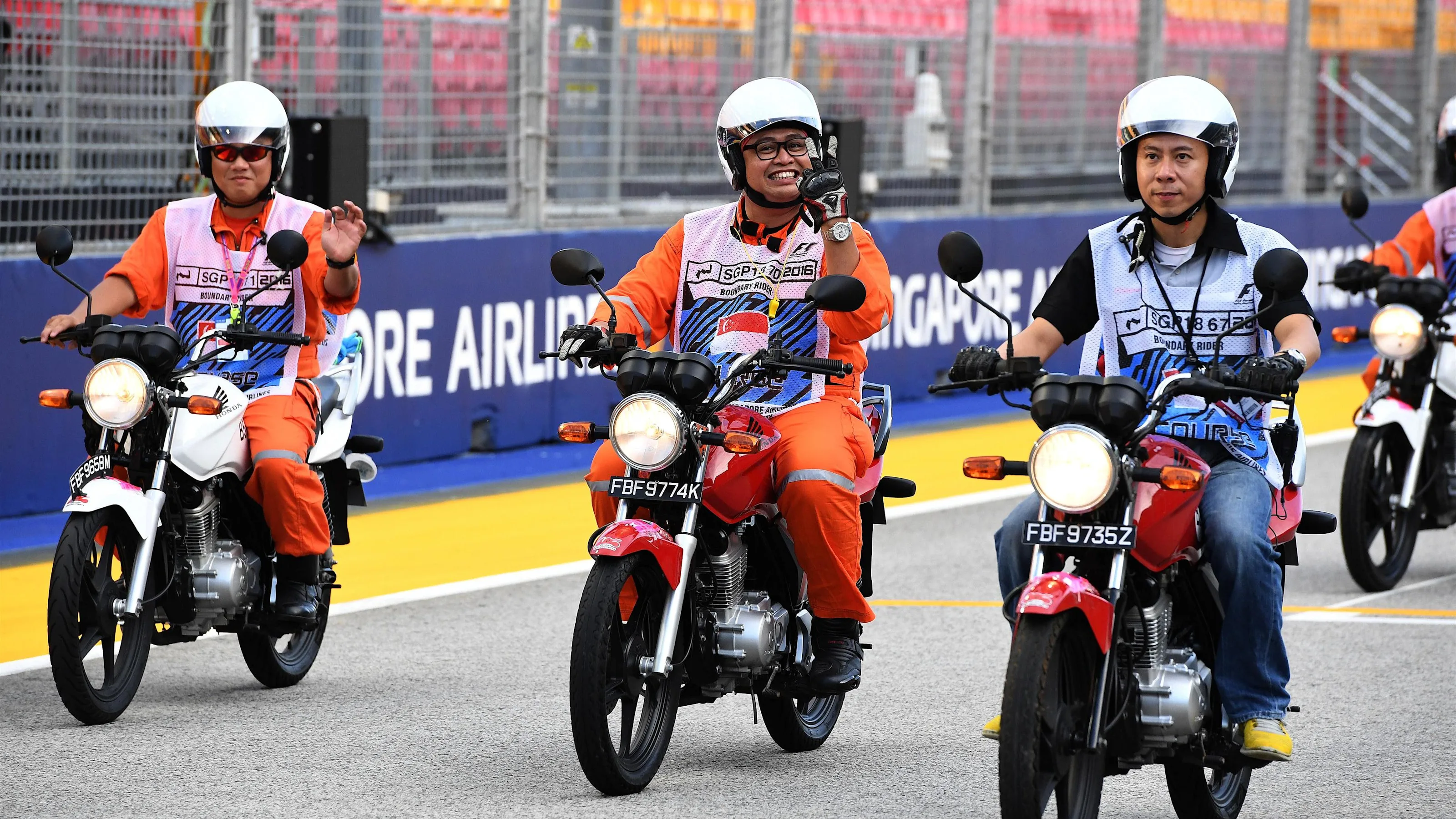 Marshals on motorbikes at Formula One World Championship, Rd15, Singapore Grand Prix, Preparations,