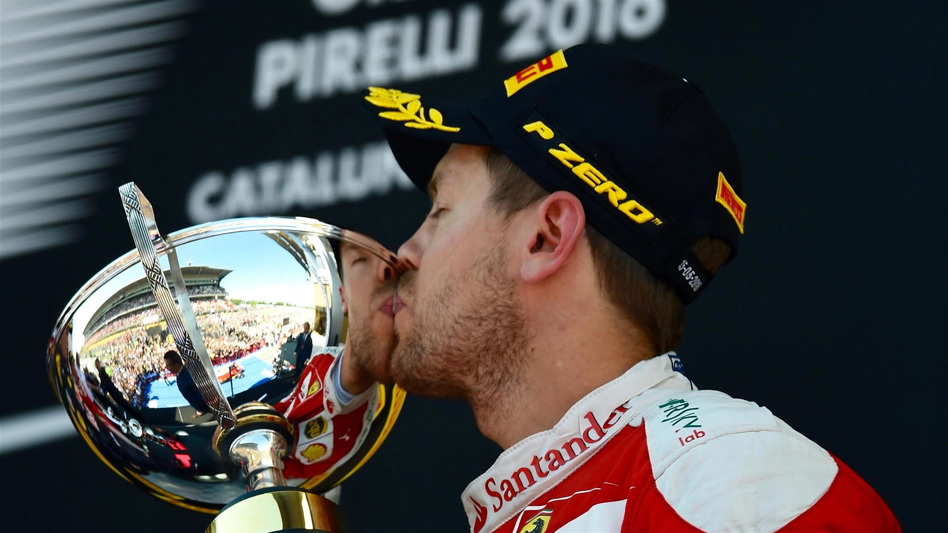 Sebastian Vettel (GER) Ferrari celebrates on the podium with the trophy at Formula One World