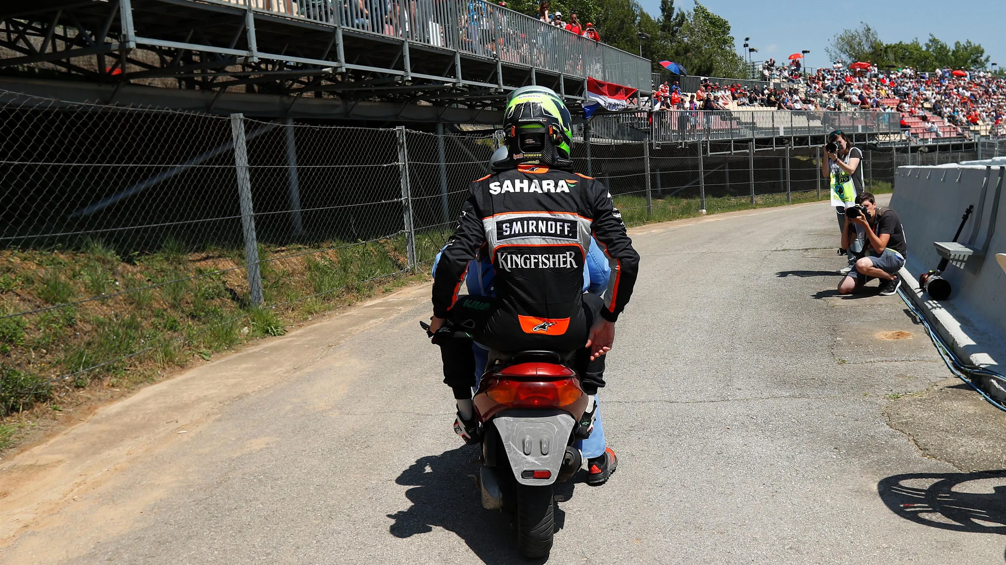 Nico Hulkenberg (GER) Force India VJM09 on a motorbike after retiring from the race at Formula One
