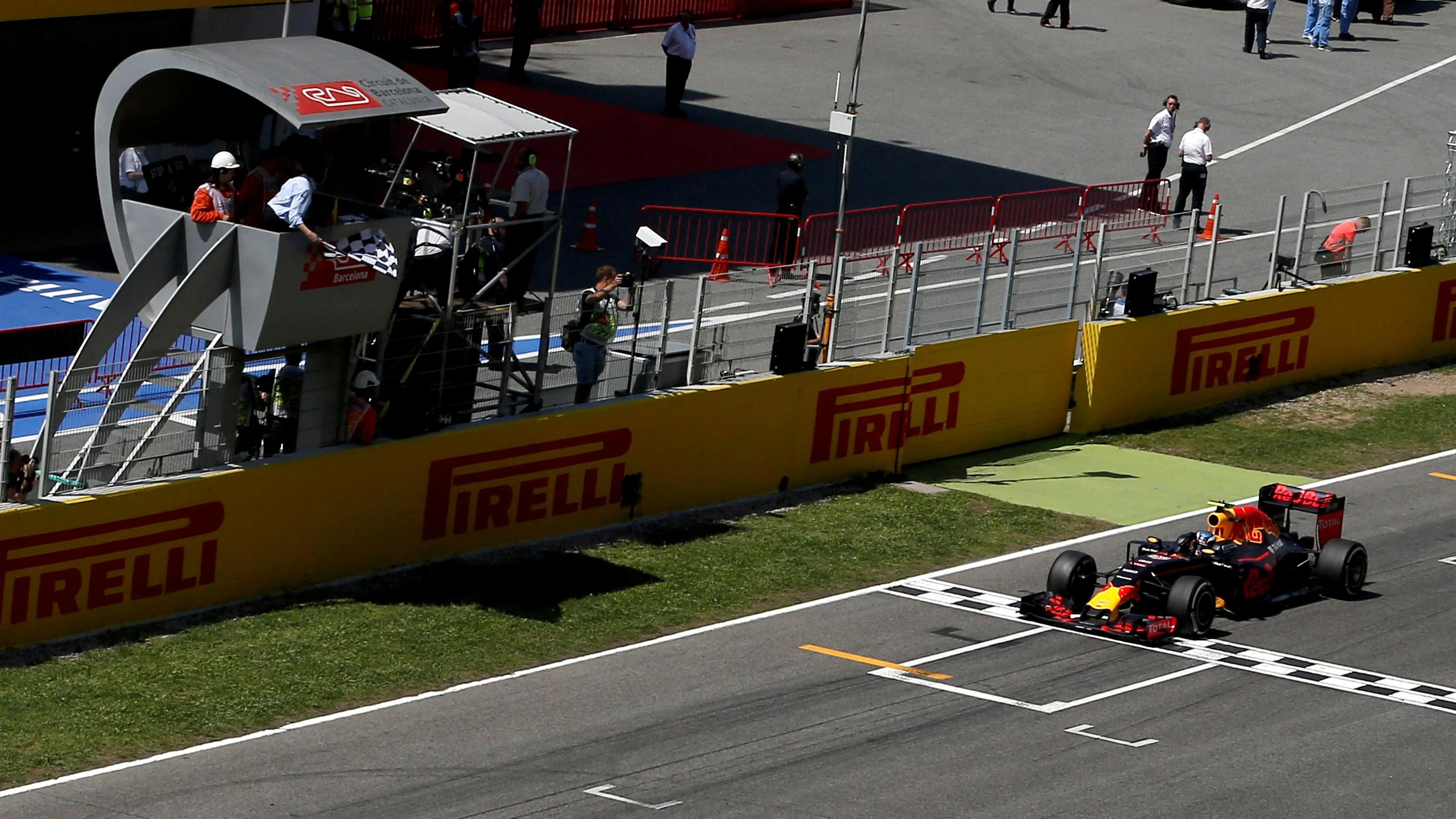 Race winner Max Verstappen (NED) Red Bull Racing RB12 crosses the line and takes the chequered flag