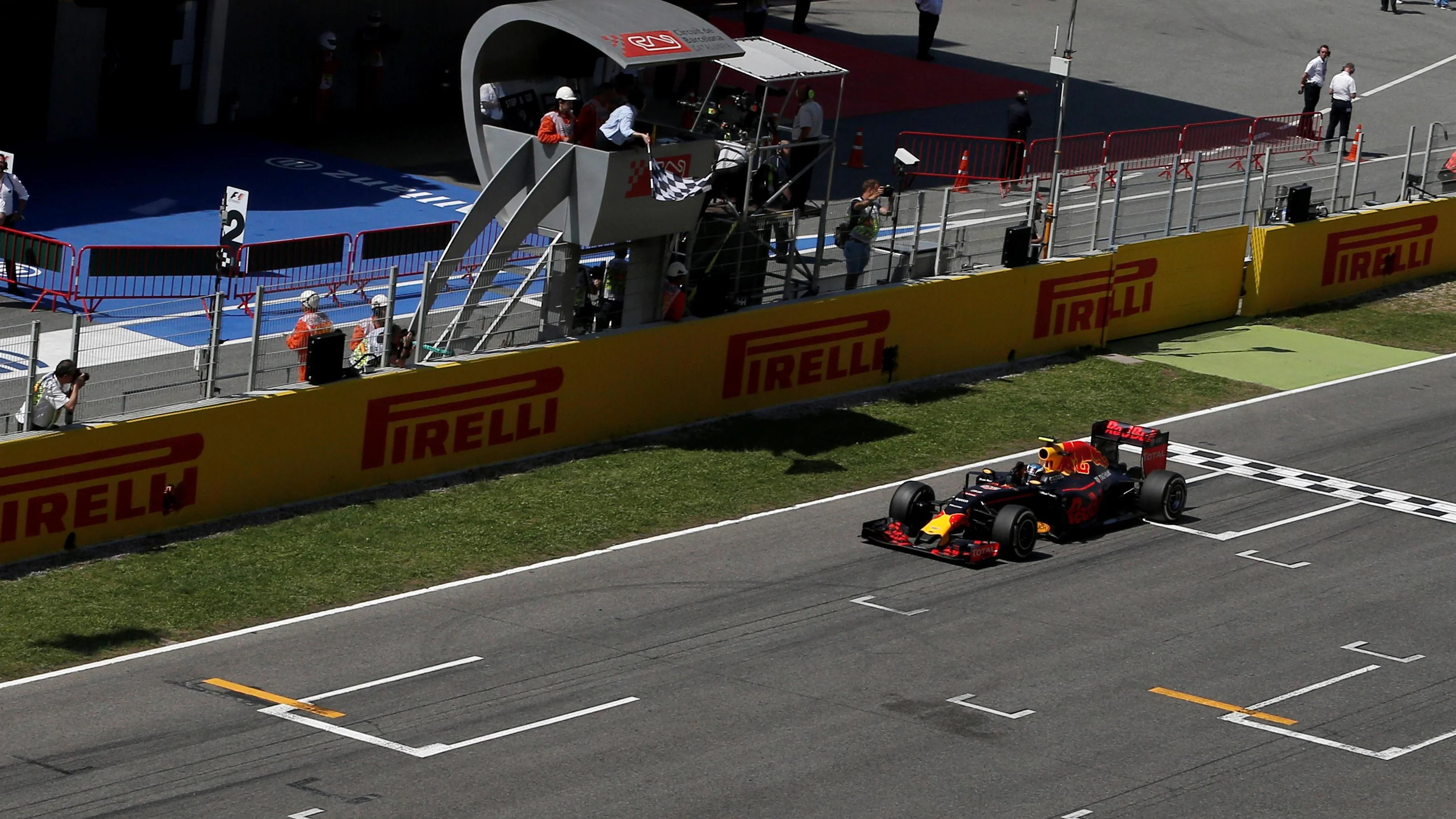 Race winner Max Verstappen (NED) Red Bull Racing RB12 crosses the line and takes the chequered flag