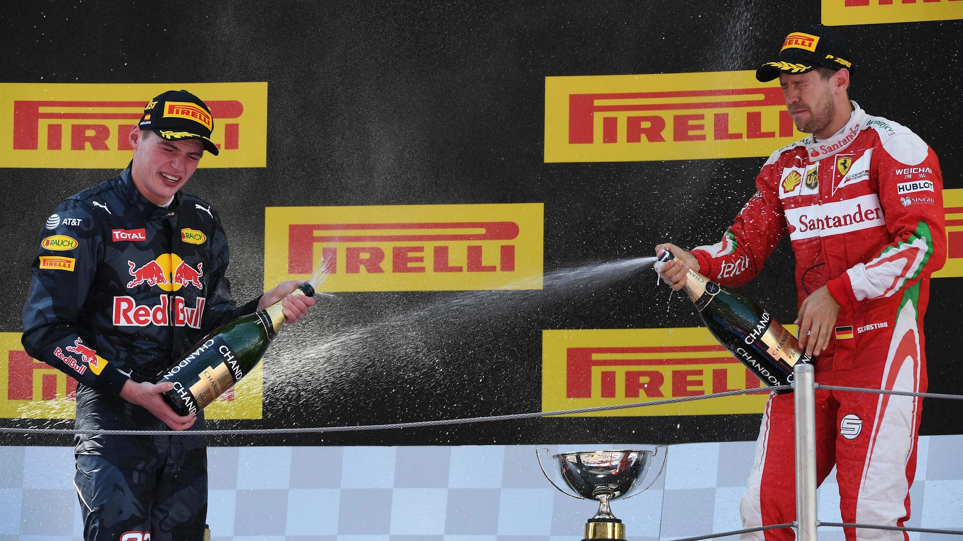 Race winner Max Verstappen (NED) Red Bull Racing celebrates on the podium with the Sebastian Vettel