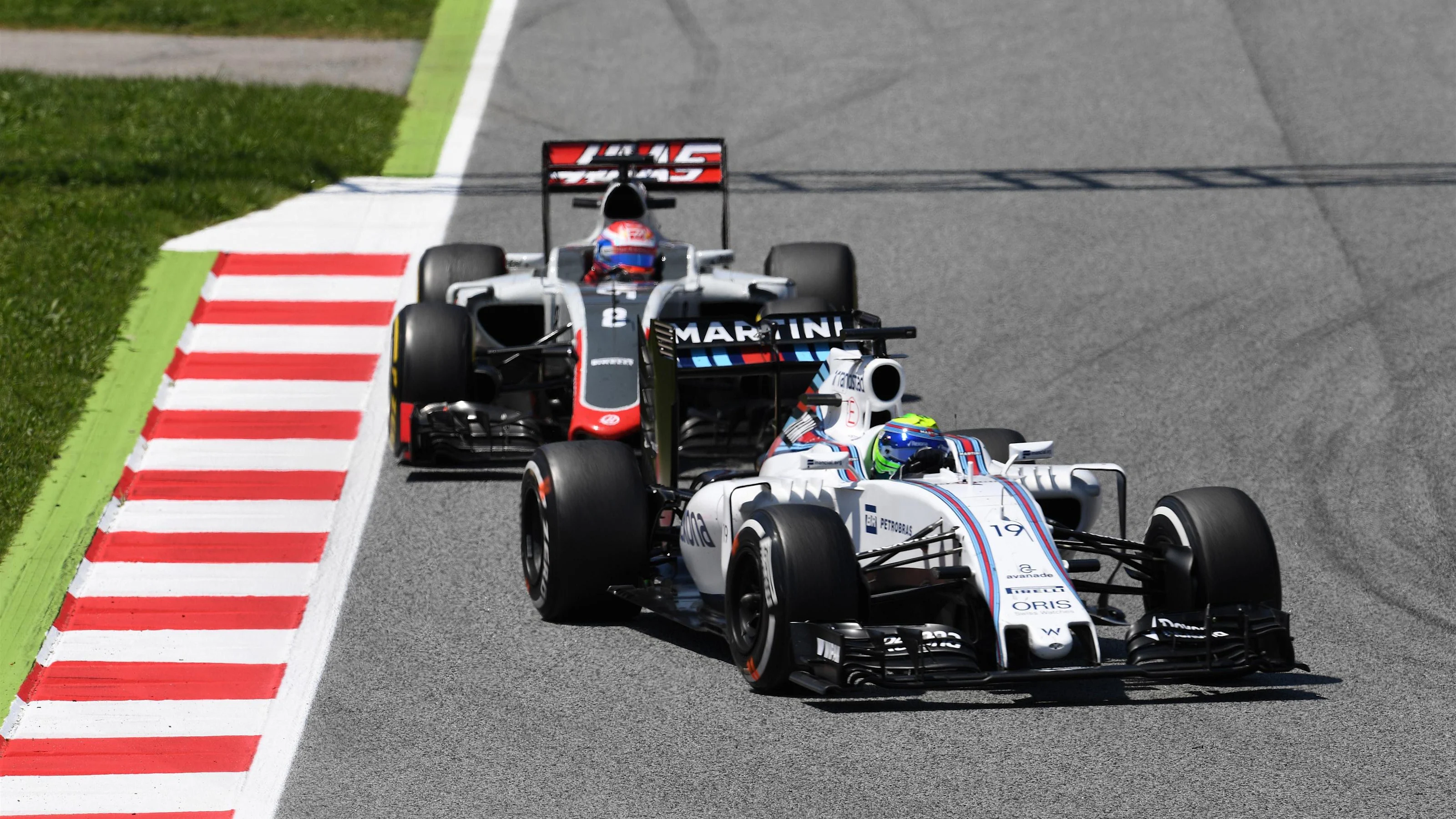 Felipe Massa (BRA) Williams FW38 and Romain Grosjean (FRA) Haas VF-16 at Formula One World