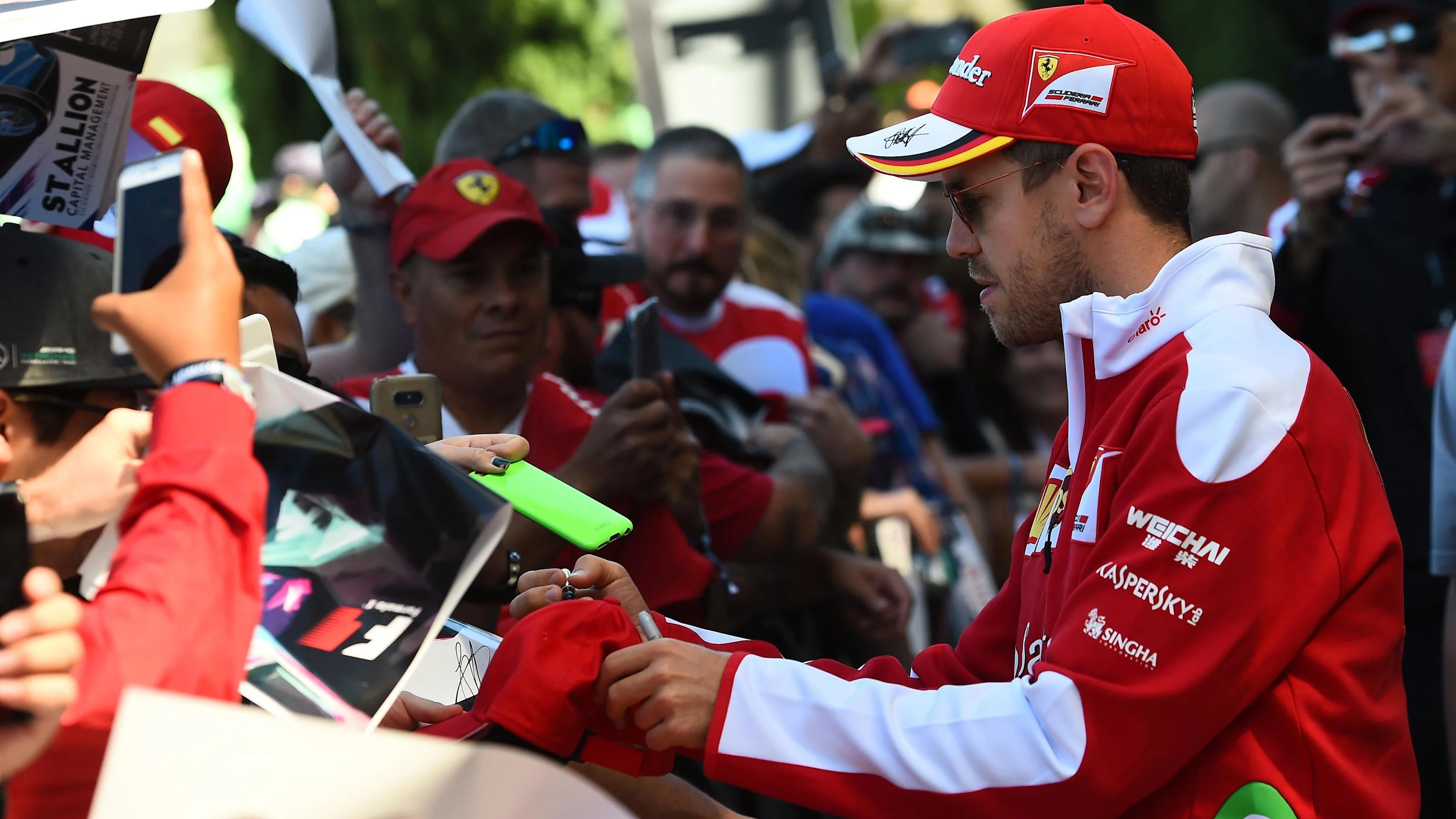 Sebastian Vettel (GER) Ferrari signs autographs for the fans at Formula One World Championship,