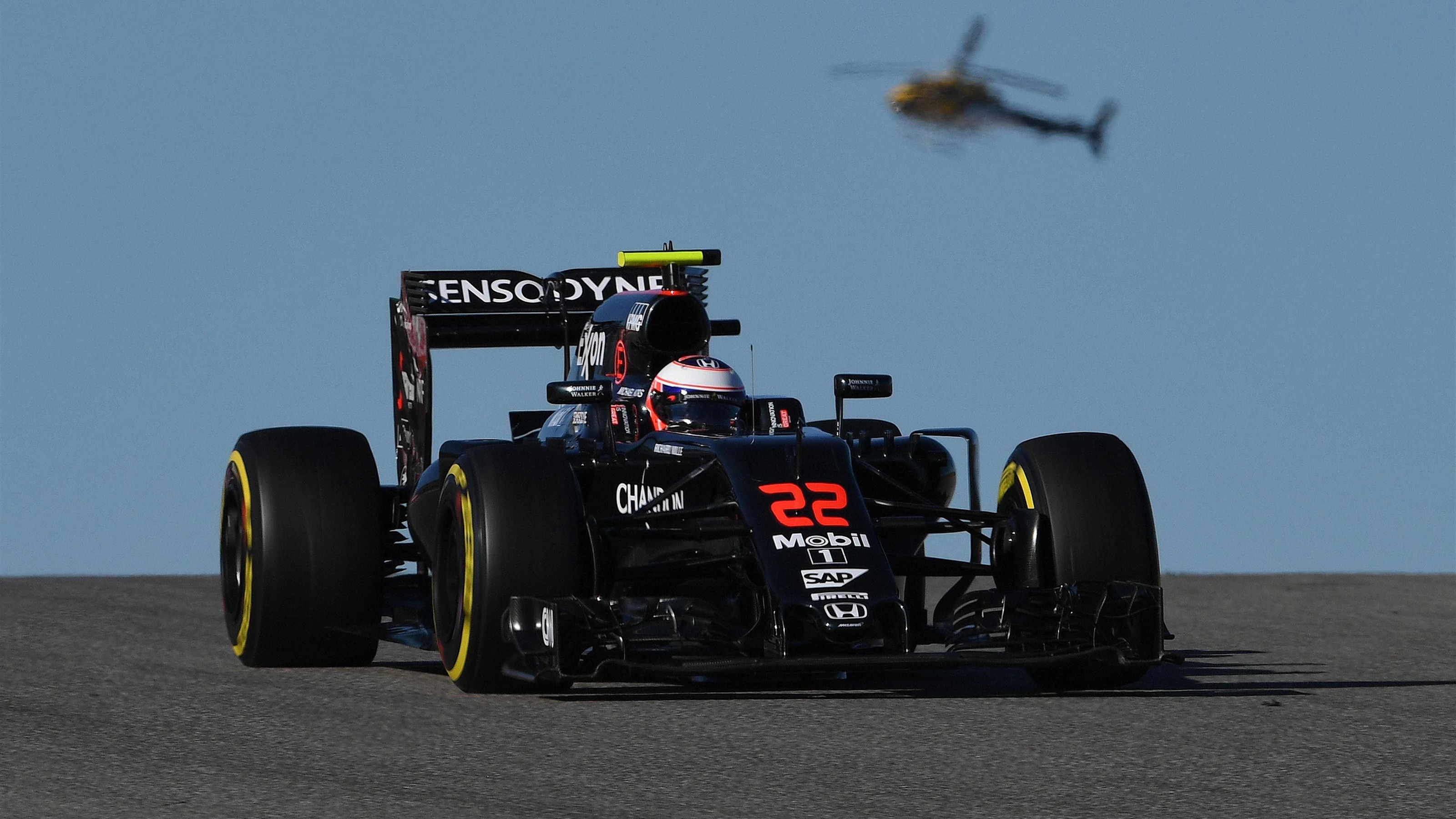 Jenson Button (GBR) McLaren MP4-31 and helicopter at Formula One World Championship, Rd18, United