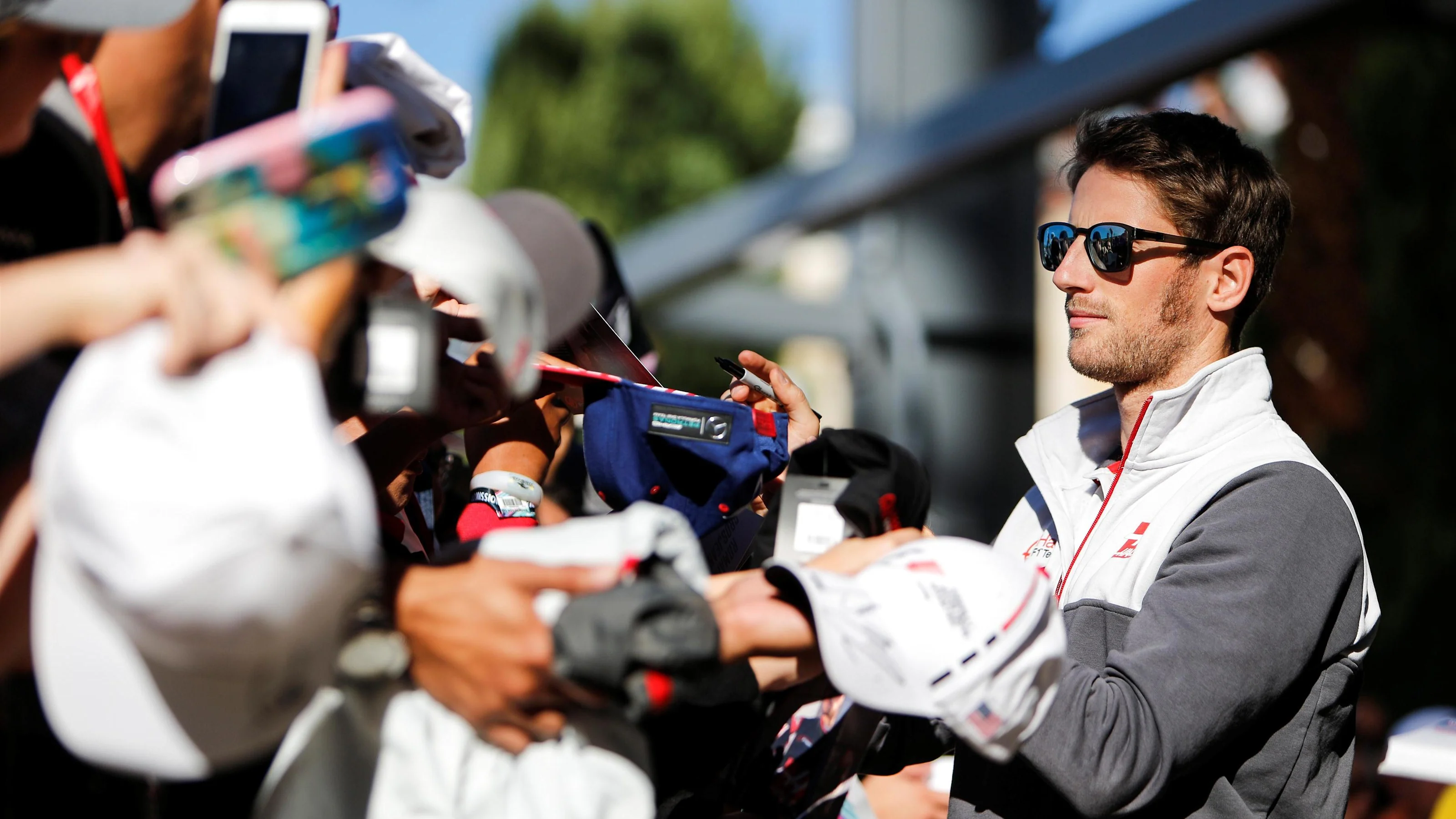 Romain Grosjean (FRA) Haas F1 signs autographs for the fans at Formula One World Championship,
