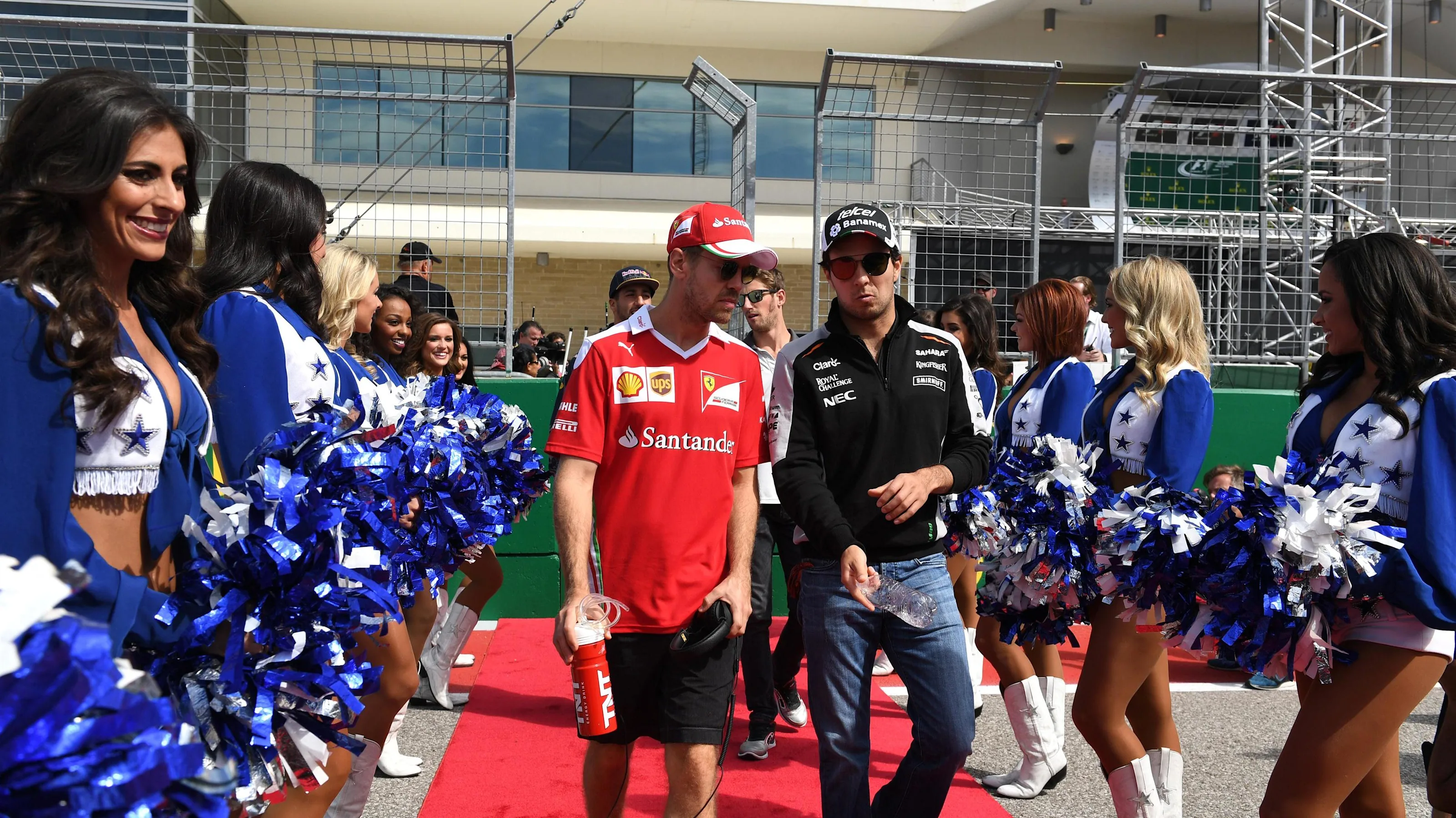 Sebastian Vettel (GER) Ferrari and Sergio Perez (MEX) Force India on the drivers parade at Formula