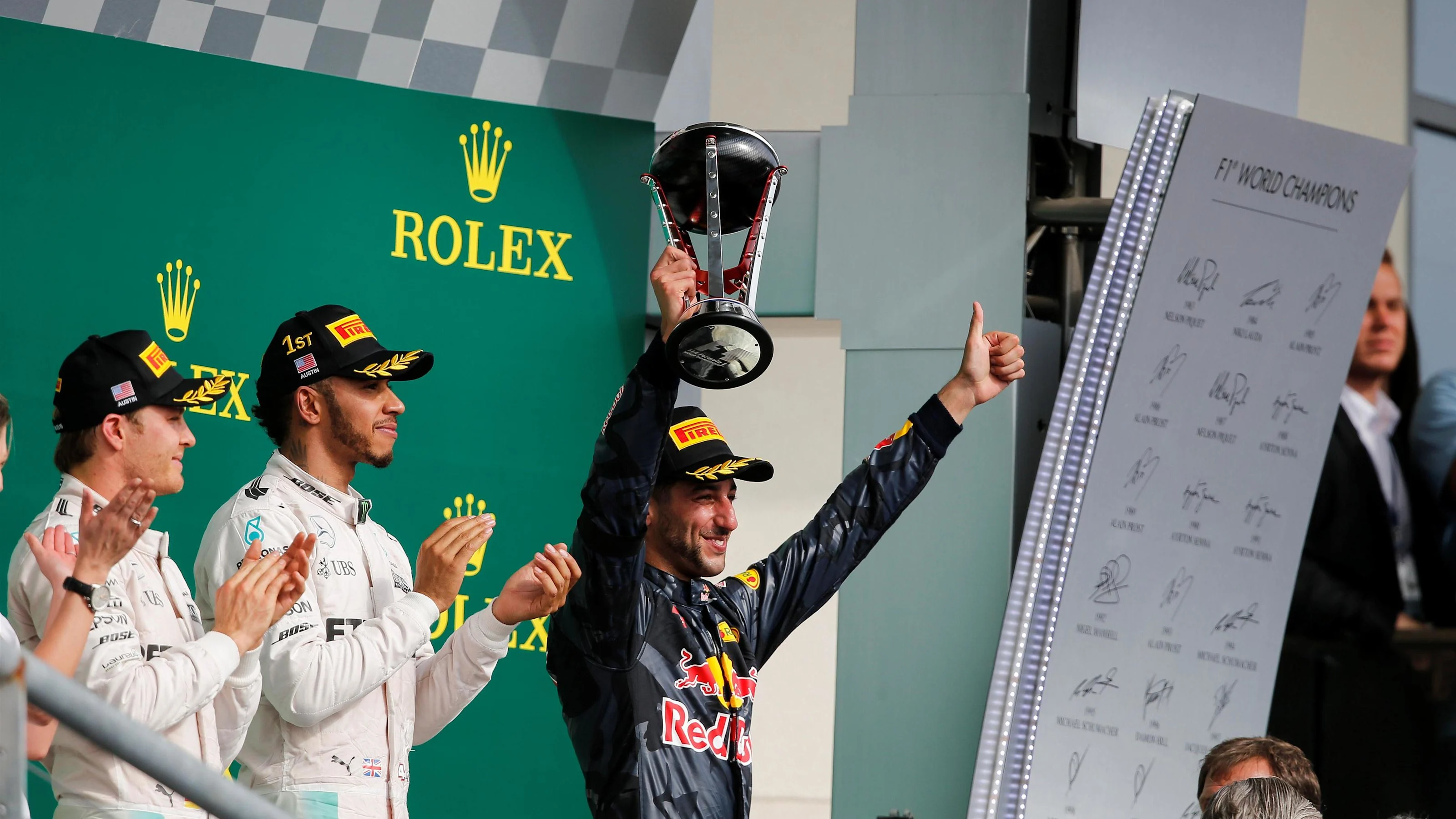 Daniel Ricciardo (AUS) Red Bull Racing celebrates on the podium with the trophy at Formula One