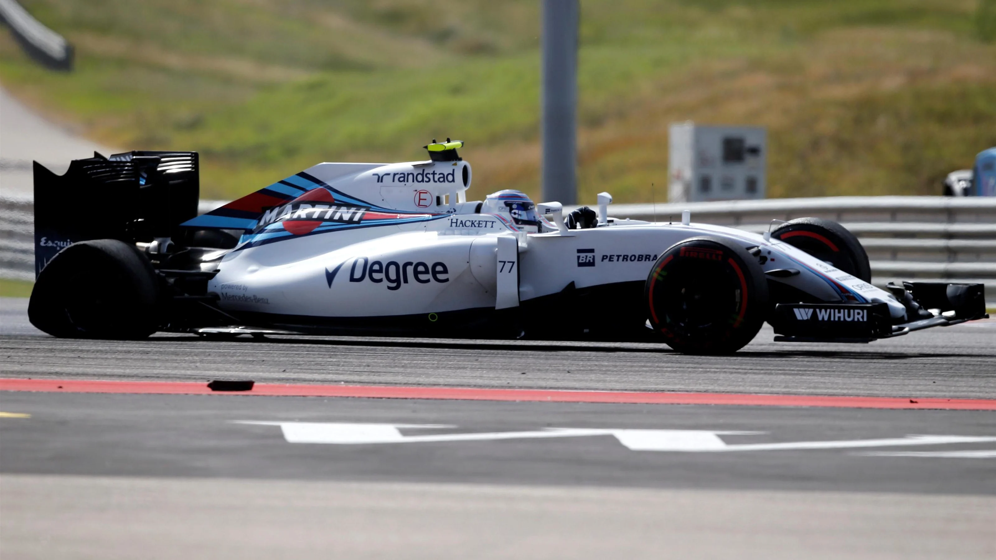 Valtteri Bottas (FIN) Williams FW38 with rear puncture damage after spinning at the start of the