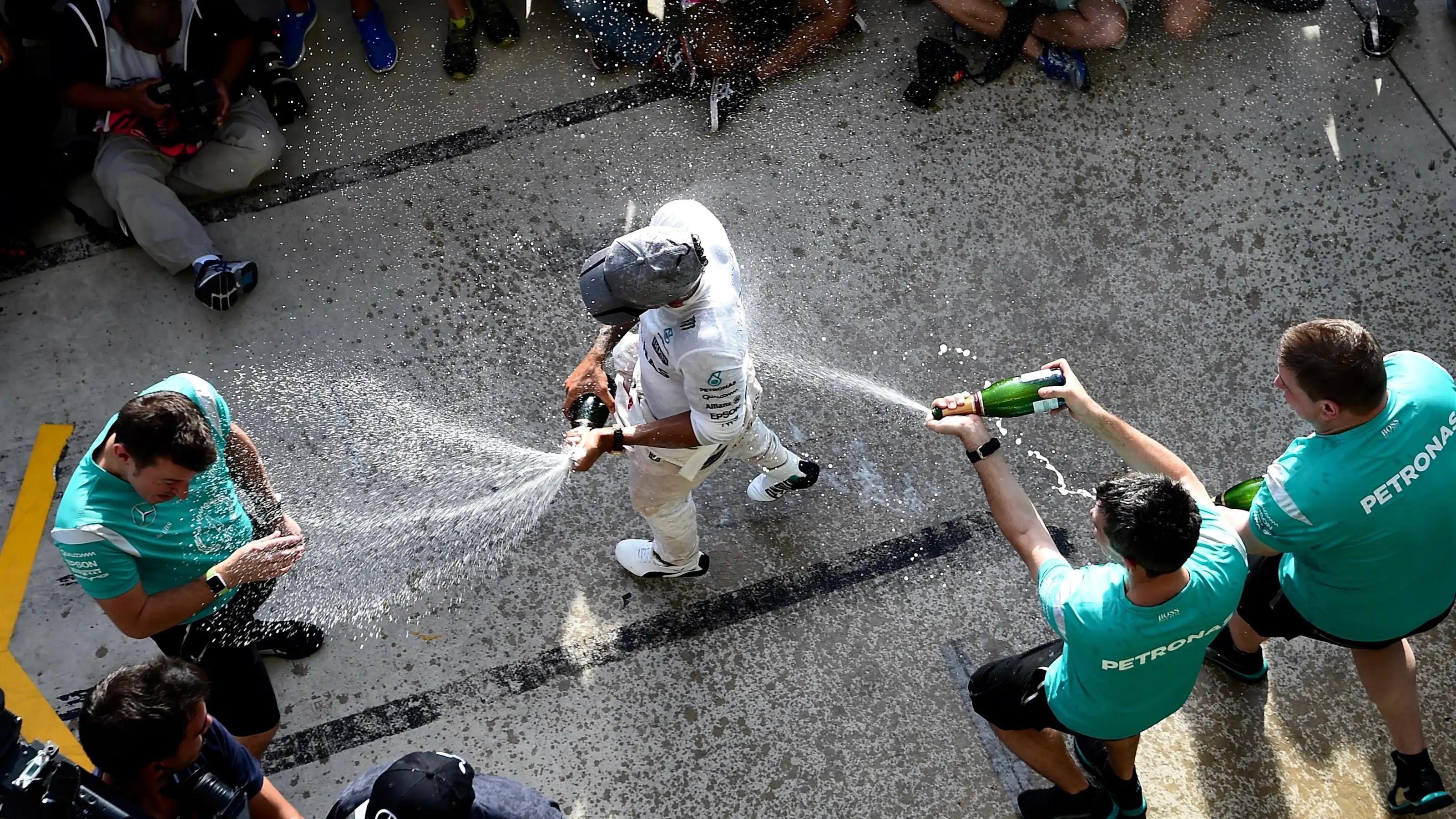 Race winner Lewis Hamilton (GBR) Mercedes AMG F1 celebrates with the team and the champagne at