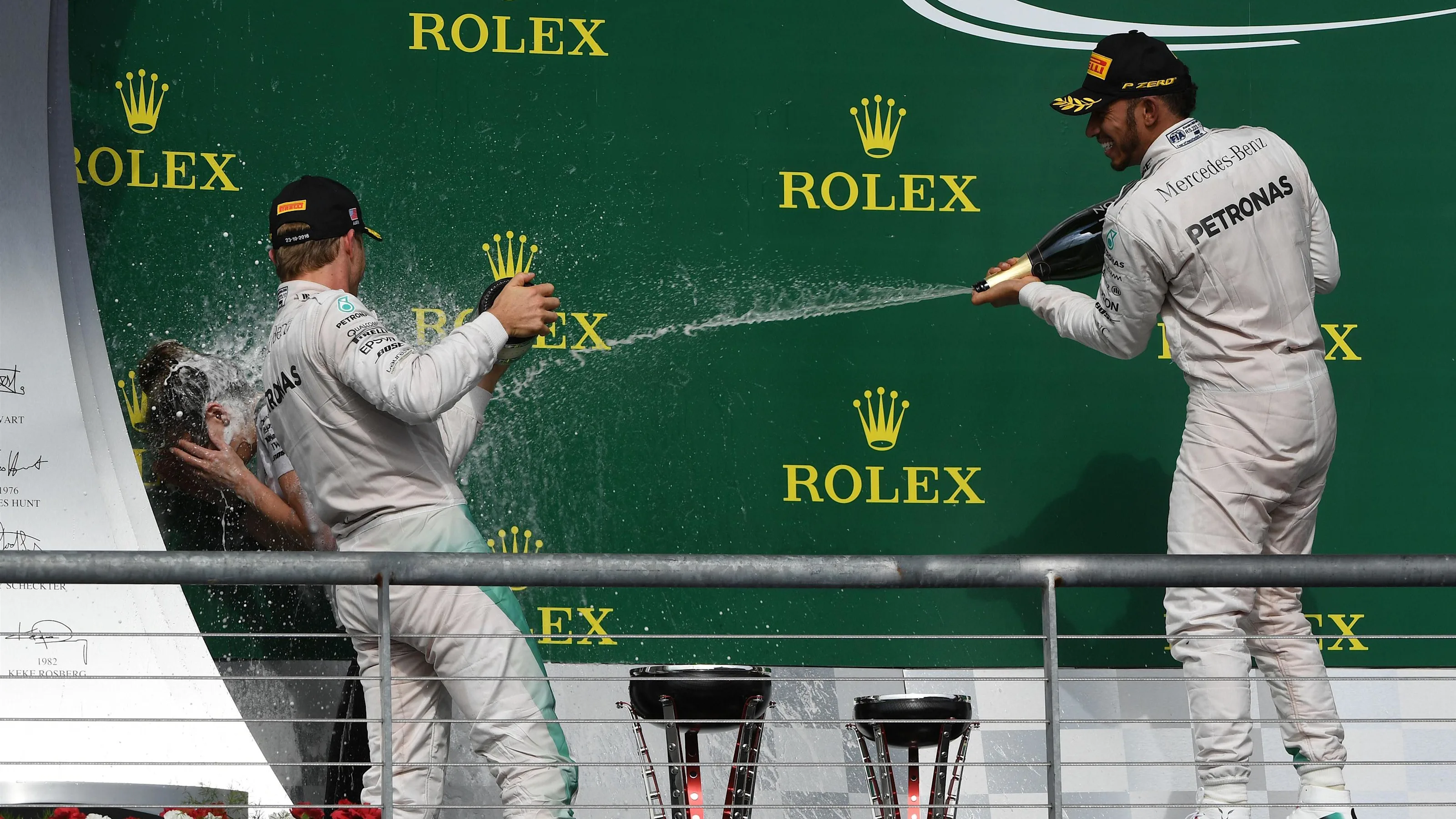 Nico Rosberg (GER) Mercedes AMG F1 and Lewis Hamilton (GBR) Mercedes AMG F1 celebrate on the podium