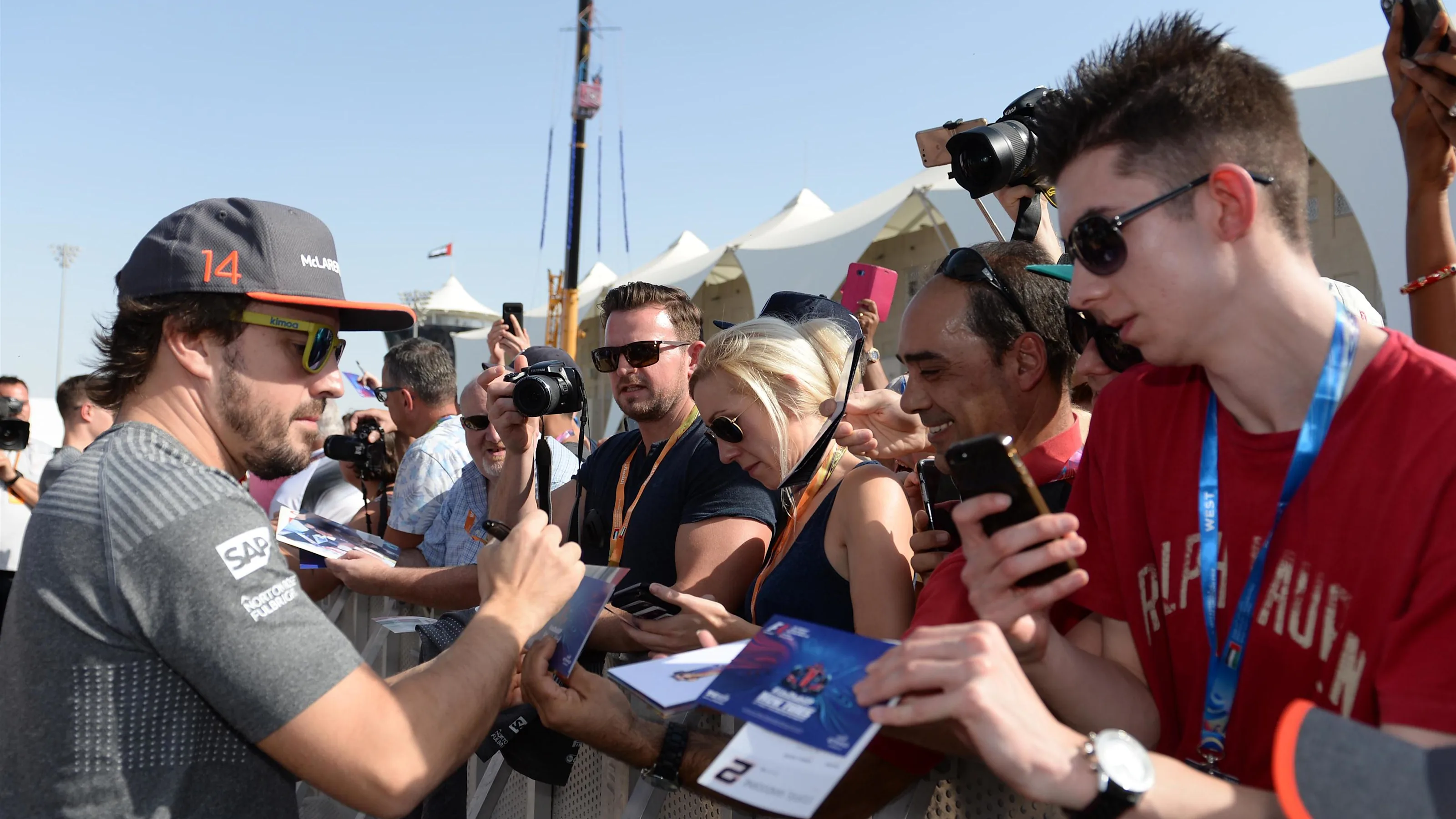 Fernando Alonso (ESP) McLaren signs autographs for the fans at Formula One World Championship,