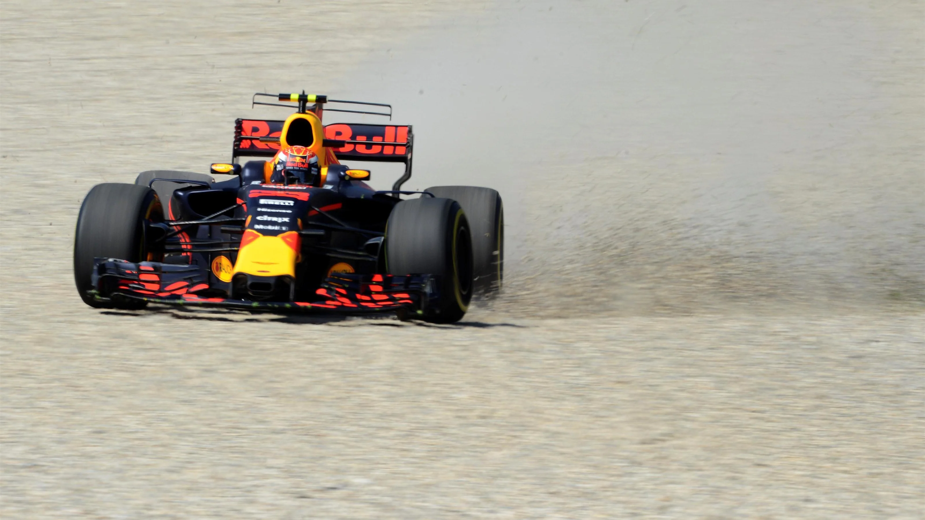 Max Verstappen (NED) Red Bull Racing RB13 spins through the gravel at Formula One World