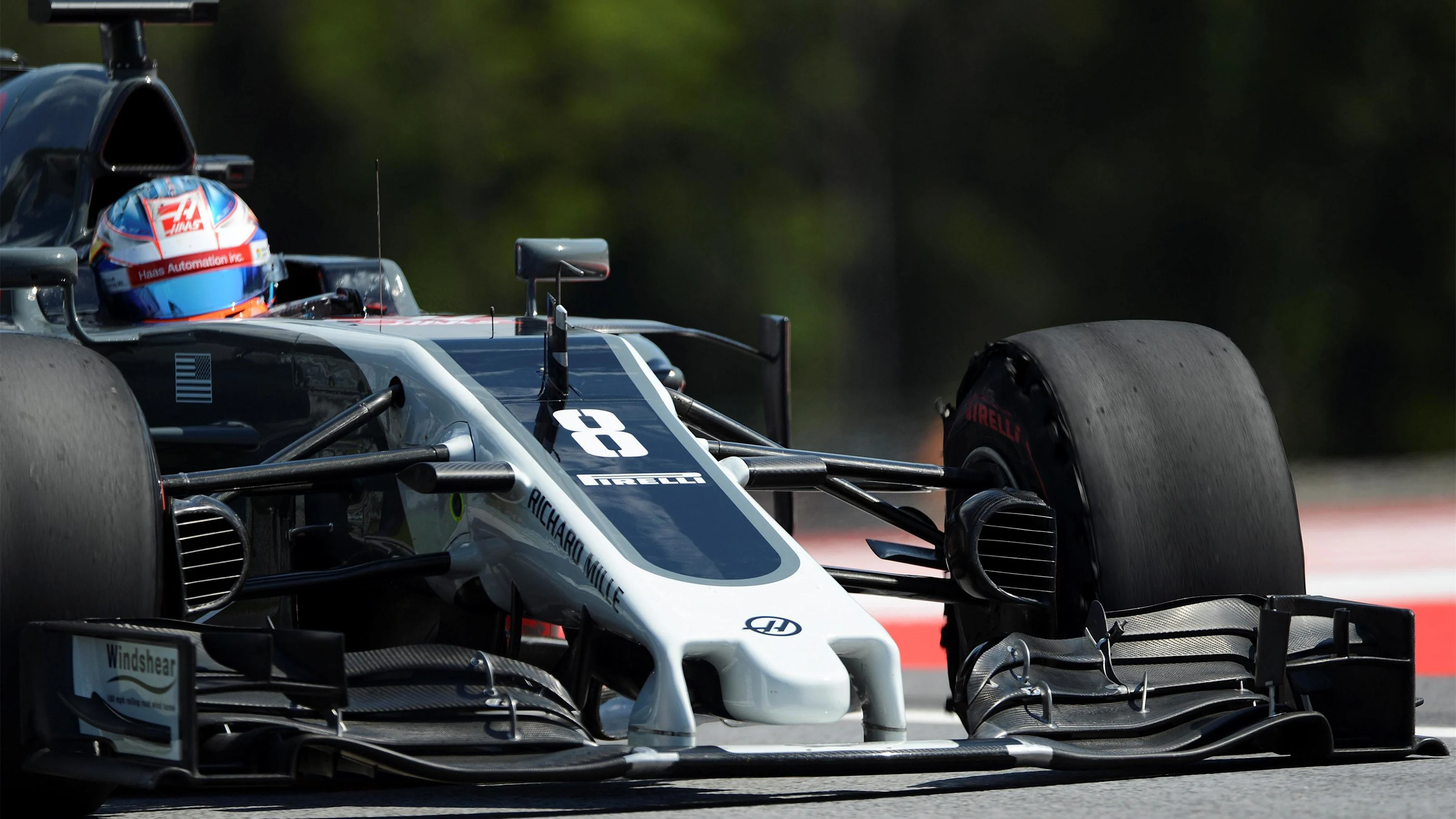Ross Brawn (GBR) Formula One Managing Director of Motorsports with front puncture at Formula One