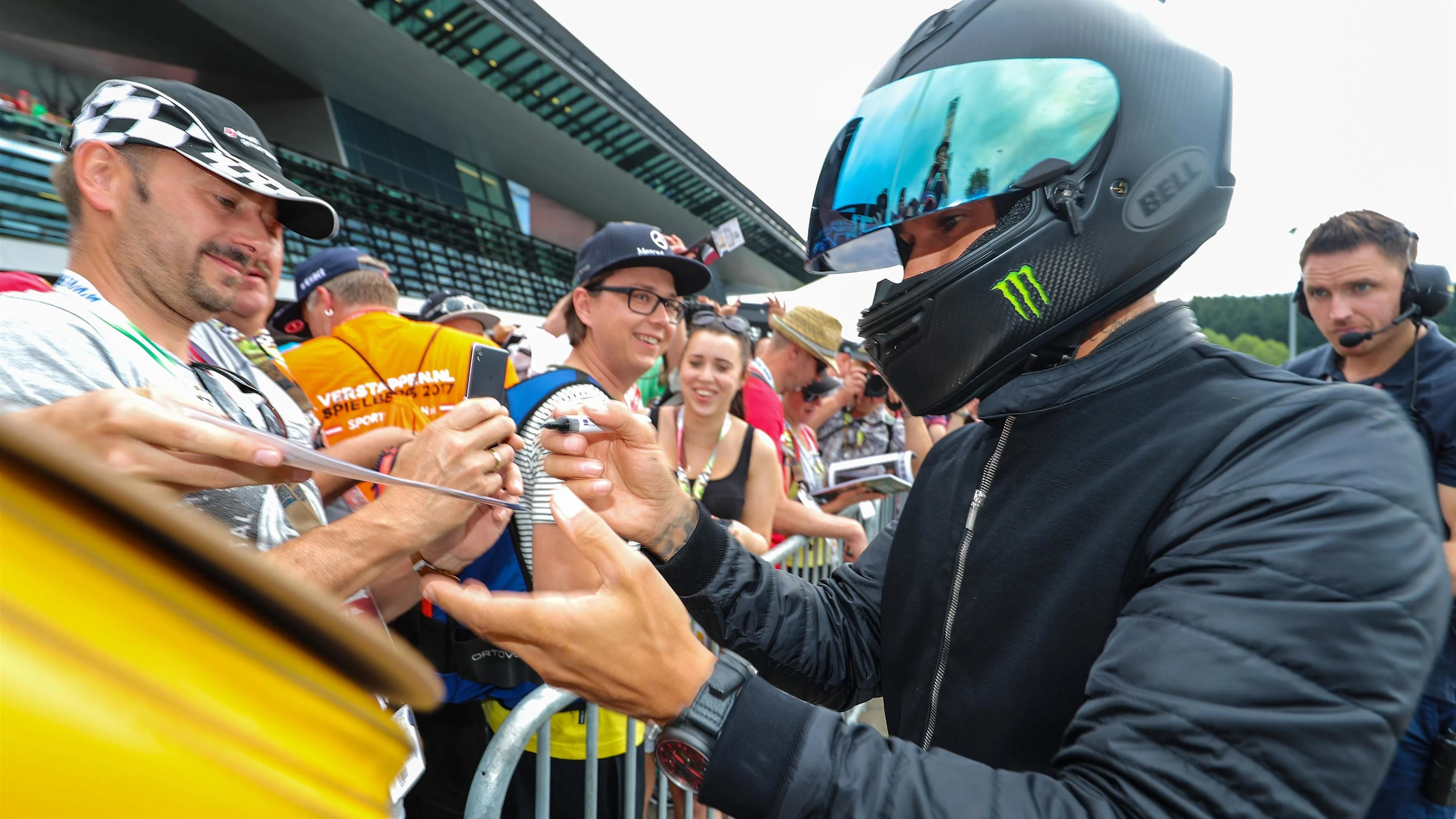 Lewis Hamilton (GBR) Mercedes AMG F1 signs autographs for the fans at Formula One World
