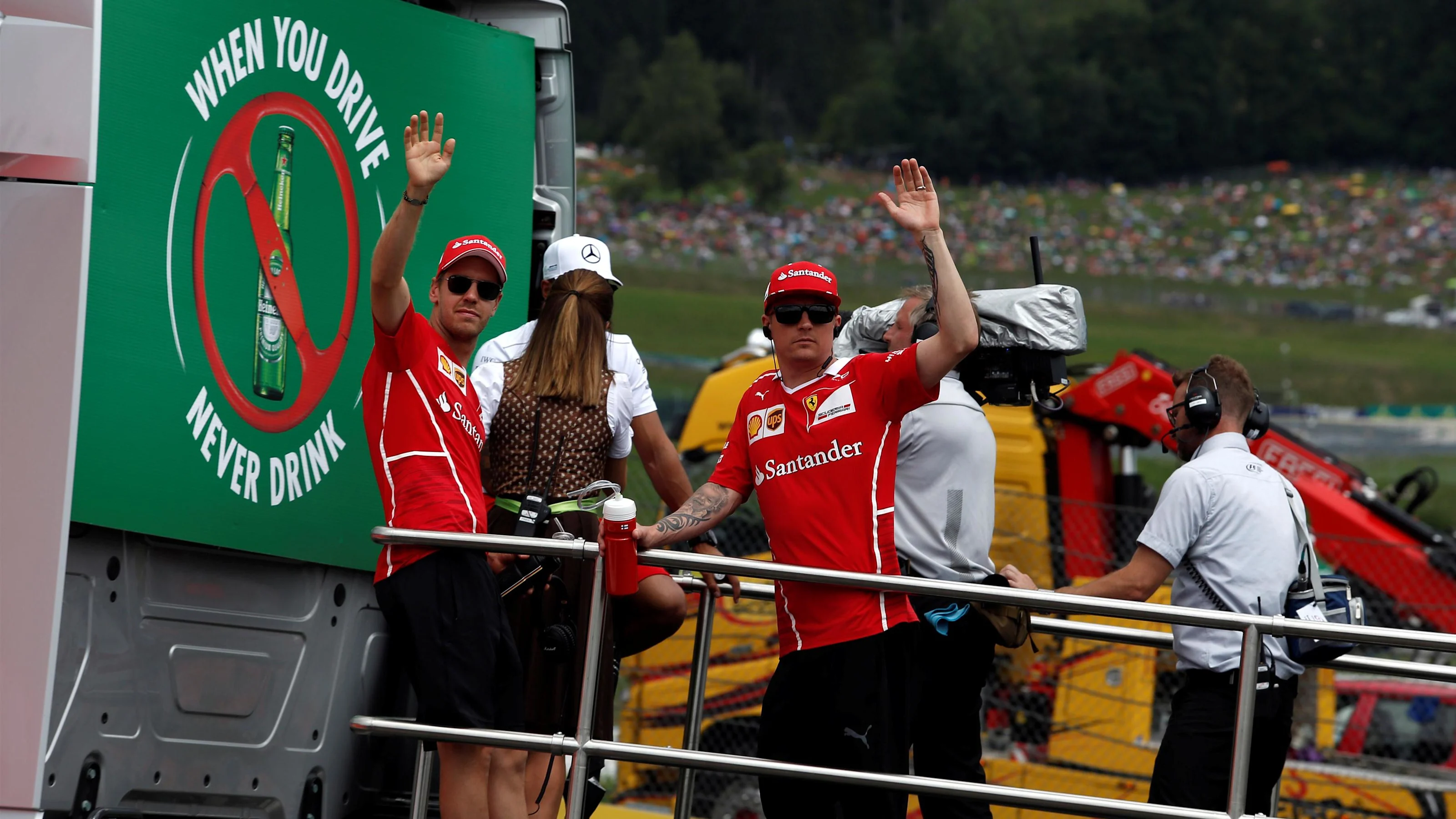 Sebastian Vettel (GER) Ferrari and Kimi Raikkonen (FIN) Ferrari on the drivers parade at Formula